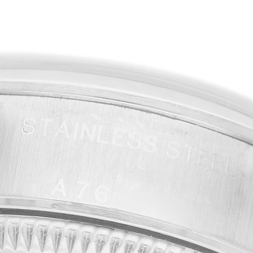 The image shows a close-up of the Rolex Date 79160 Women's Stainless Steel Pink Dial model's stainless steel case side and bezel.