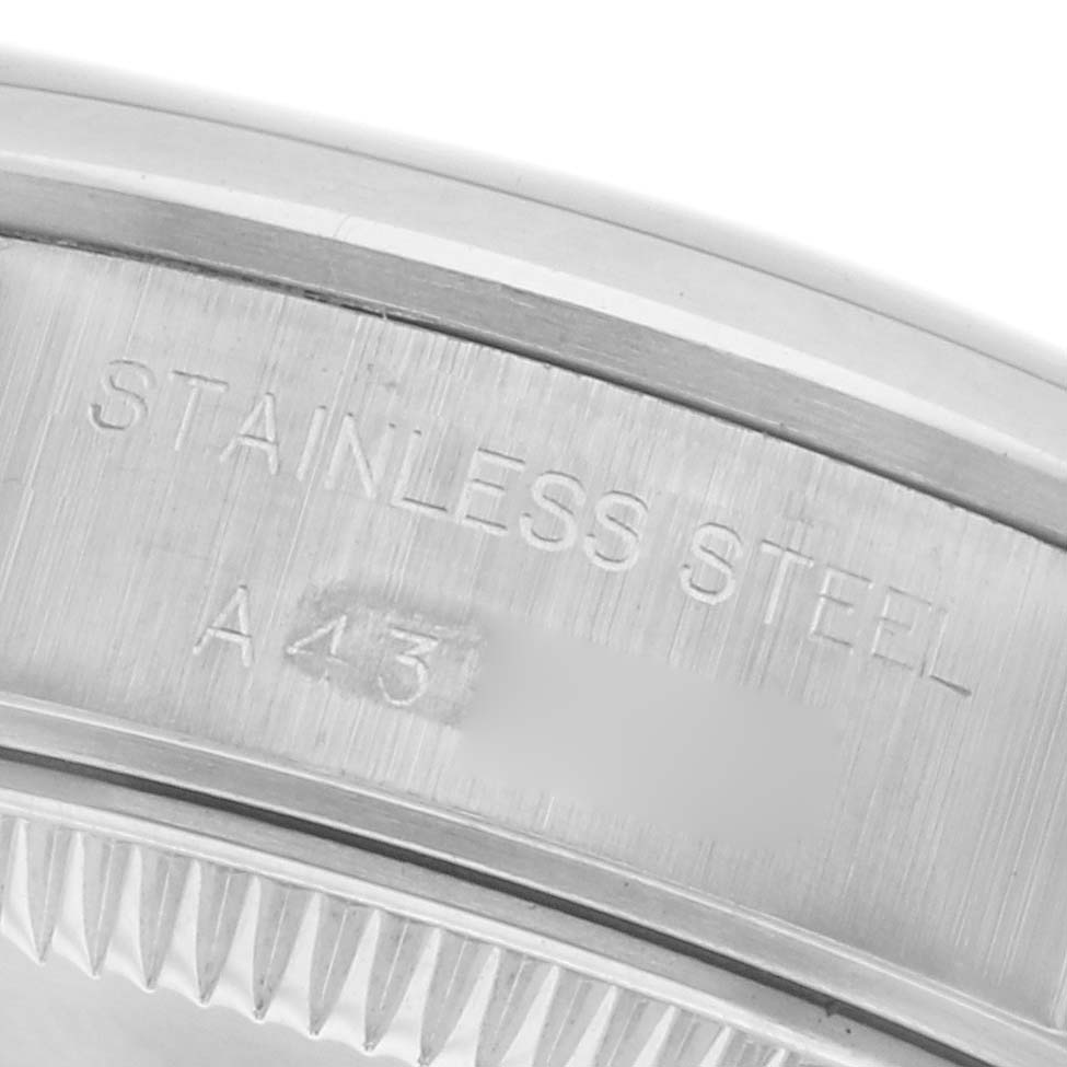 The image shows the inner caseback engraving of a Rolex Date 69160 Women's Stainless Steel White Dial 69160 Women's Stainless Steel White Dial model, highlighting "Stainless Steel" and partial model markings.