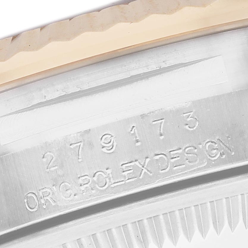 This image shows a close-up of the Rolex Datejust 279173 Women's Steel and Gold (two tone) Green Dial 279173 Women's Steel and Gold (two tone) Green Dial case, focusing on the engraved serial number and "ORIG ROLEX DESIGN" text.