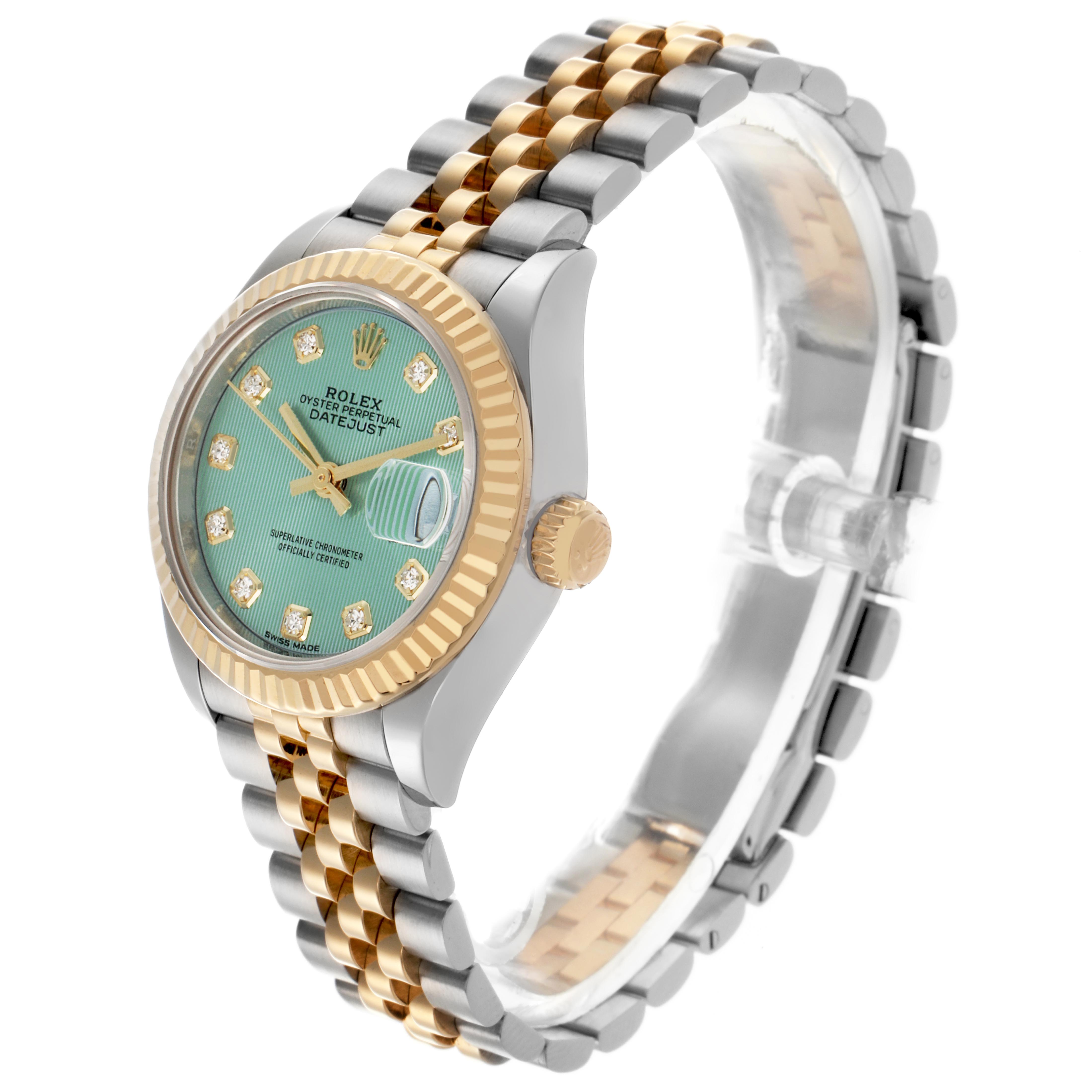 The Rolex Datejust 279173 Women's Steel and Gold (two tone) Green Dial 279173 Women's Steel and Gold (two tone) Green Dial watch is shown at a three-quarter angle, displaying the face, fluted bezel, crown, and two-tone bracelet.