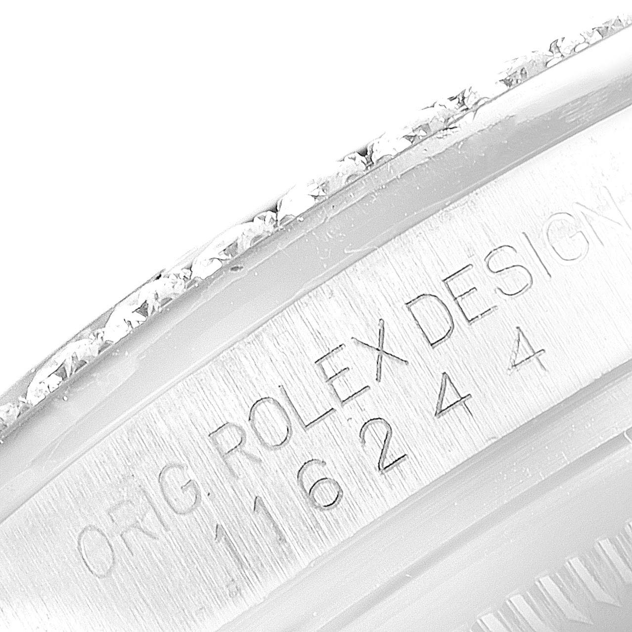 This is a close-up of the case side engraving showing the serial number and design details of a Rolex Datejust 116244 Men's Stainless Steel Mother of Pearl Dial 116244 Men's Stainless Steel Mother of Pearl Dial watch.