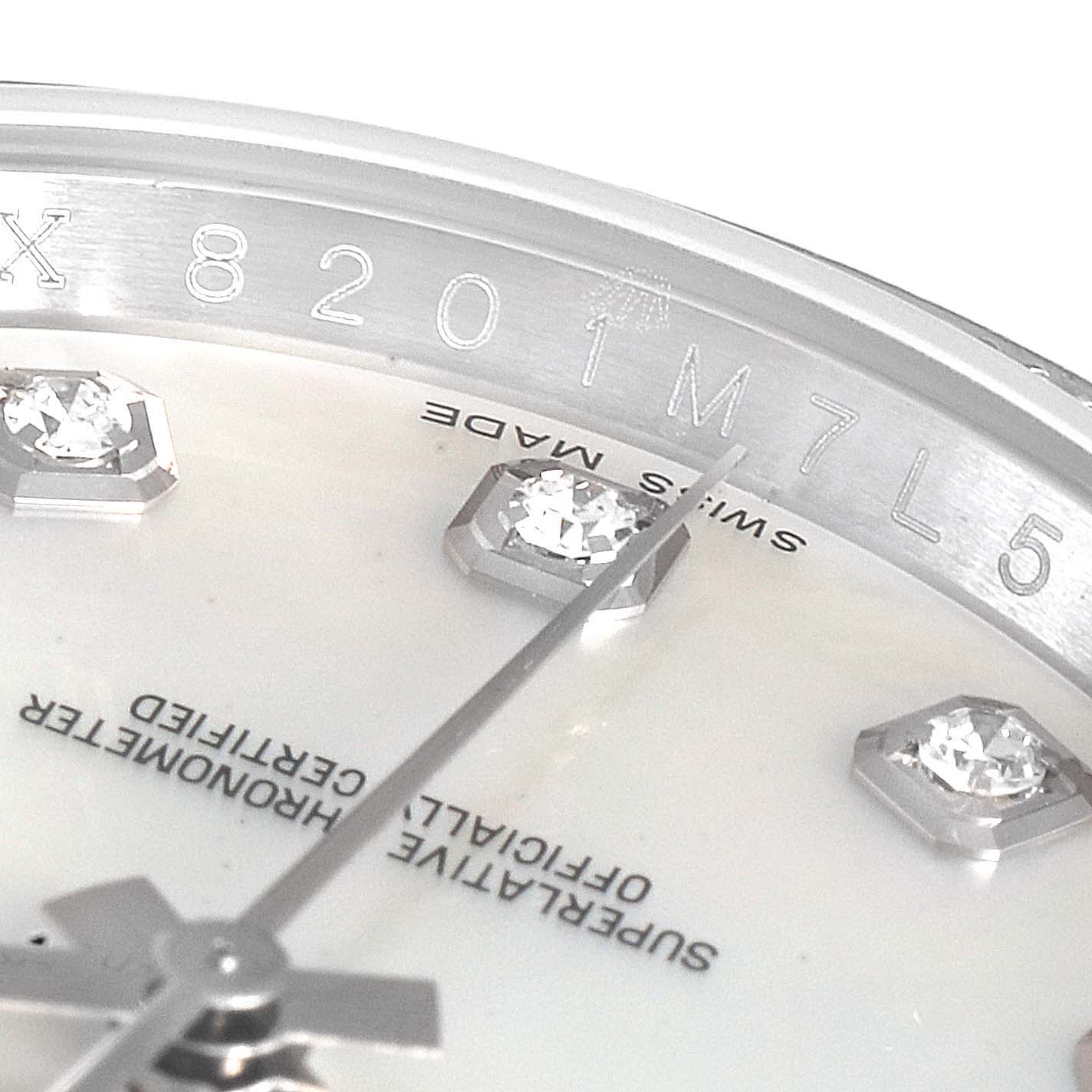 This image shows a close-up of the Rolex Datejust 116244 Men's Stainless Steel Mother of Pearl Dial 116244 Men's Stainless Steel Mother of Pearl Dial watch dial and the serial number on the inner bezel.