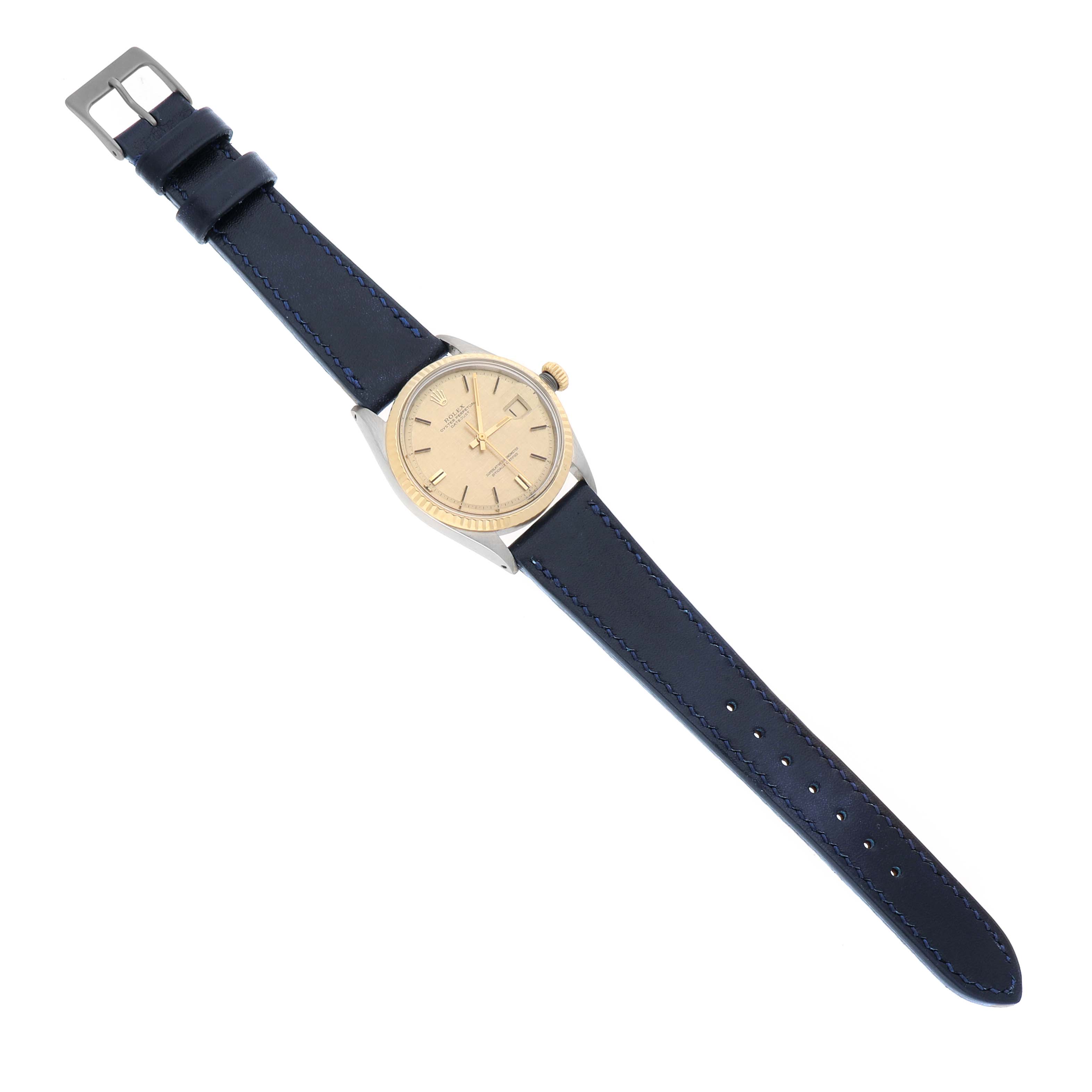 The Rolex Datejust 1601 Men's Steel and Gold (two tone) Champagne Dial watch is shown from a top-down view, displaying its dial, case, bezel, crown, and blue leather strap.