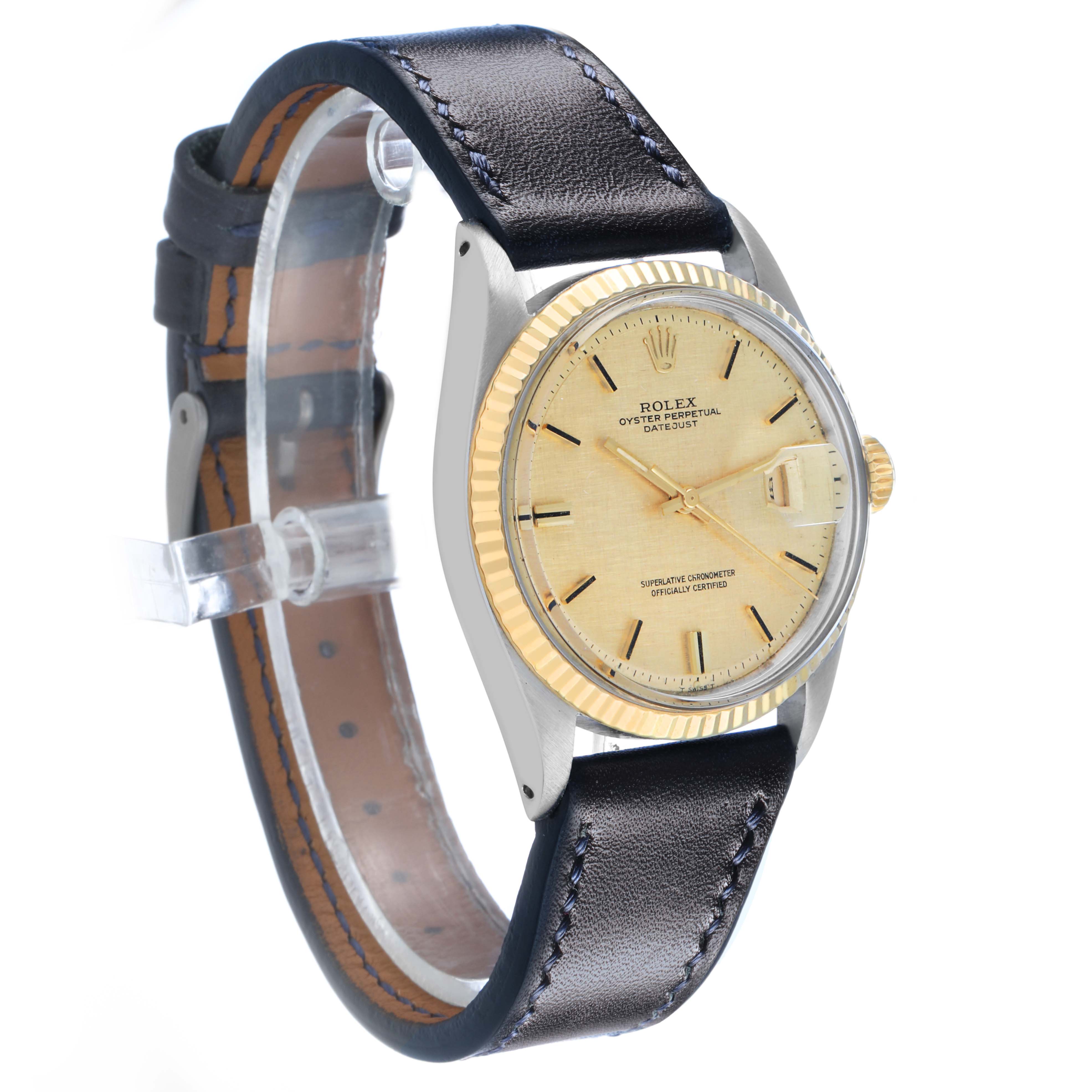 The Rolex Datejust 1601 Men's Steel and Gold (two tone) Champagne Dial watch is shown at a three-quarter angle, highlighting the dial, bezel, crown, and leather strap.