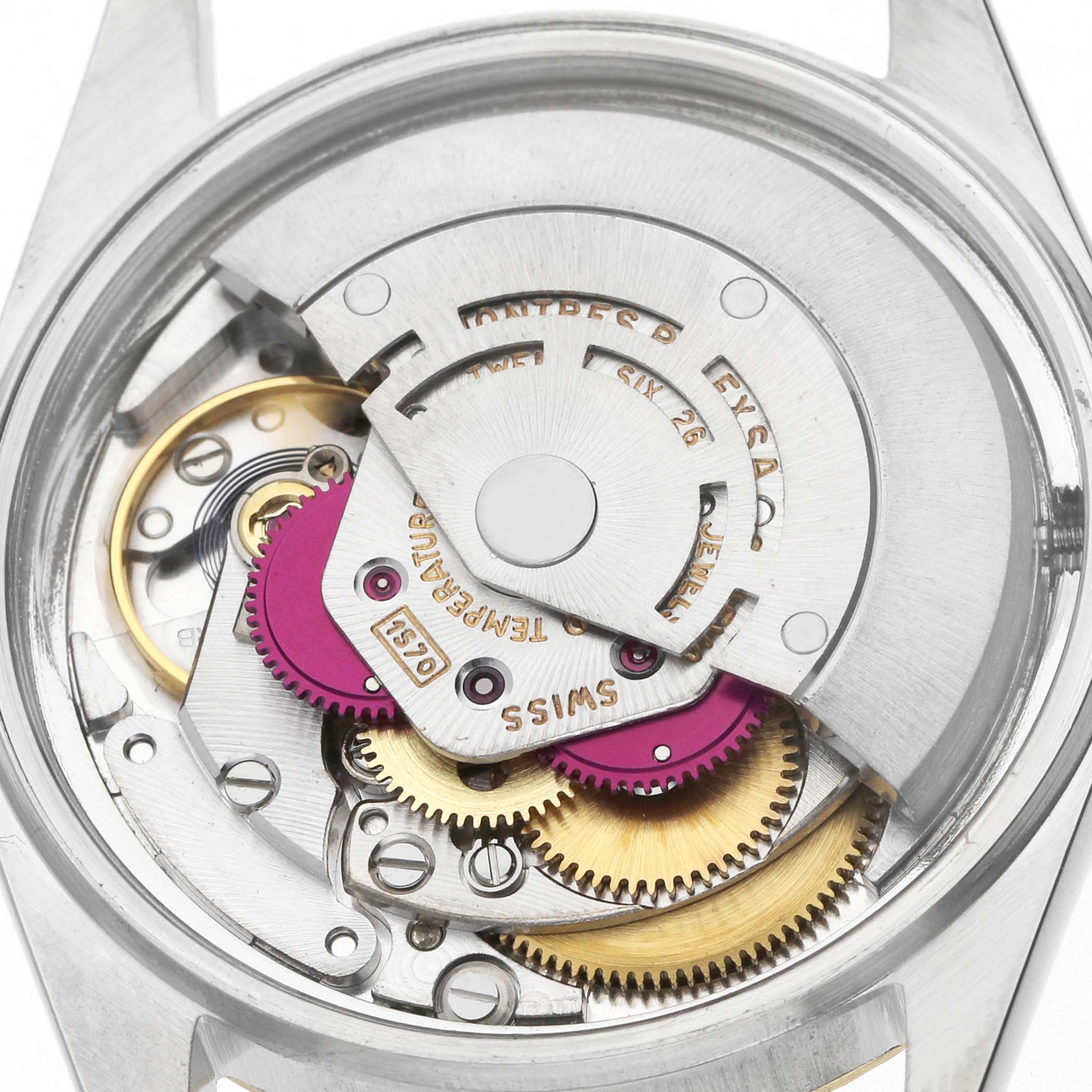 The image shows the internal movement of a Rolex Datejust 1601 Men's Steel and Gold (two tone) Champagne Dial watch, featuring gears and the rotor from the back view.