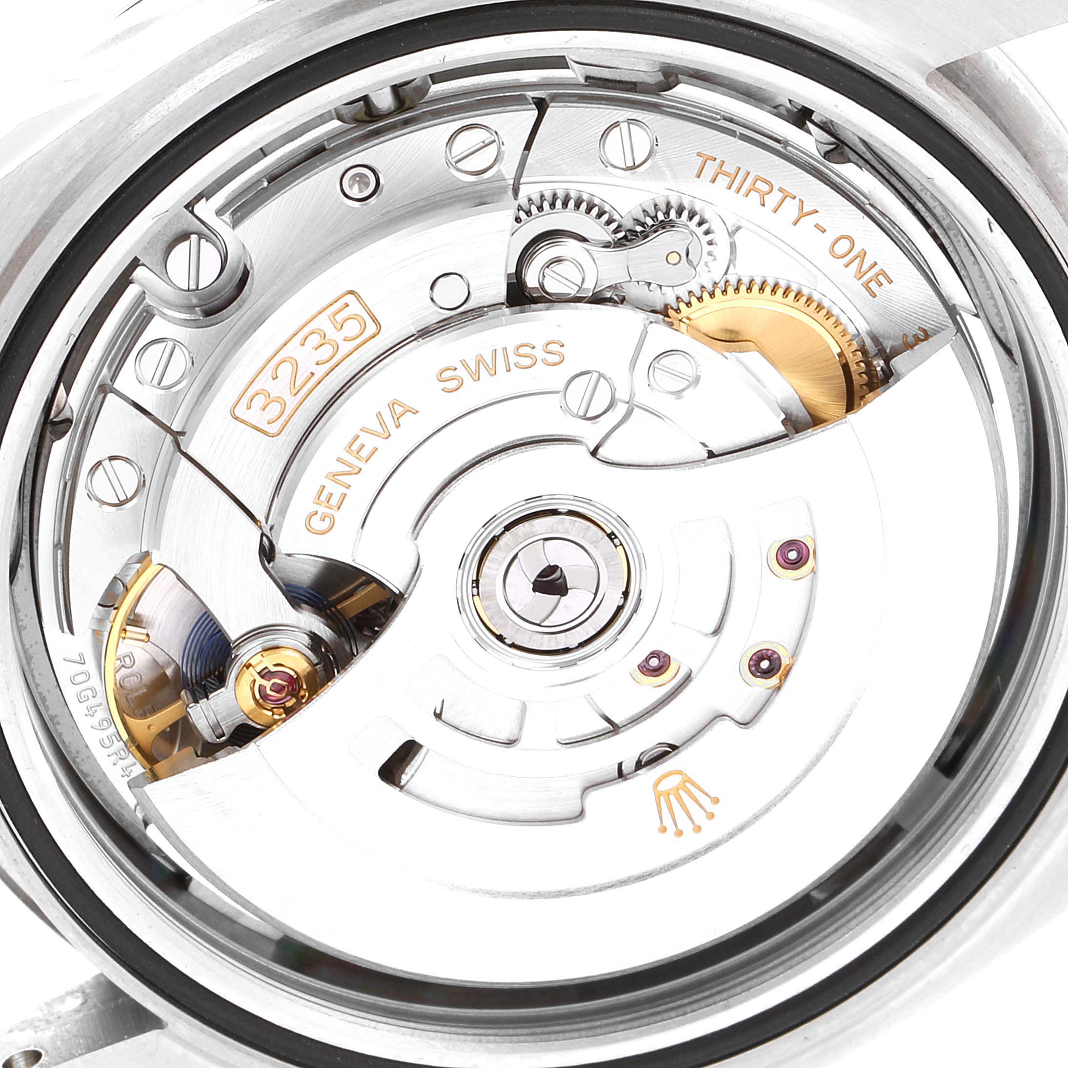 The image shows the internal mechanism of a Rolex Datejust 41 126300 Men's Stainless Steel Blue Dial 126300 Men's Stainless Steel Blue Dial watch with a focus on the movement and intricate components labeled "3235" and "Geneva Swiss."