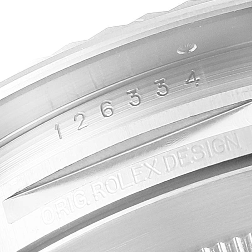 This image shows a close-up of the case and bezel of a Rolex Datejust 126334 Men's Stainless Steel White Dial 126334 Men's Stainless Steel White Dial watch, featuring the model number and "Orig Rolex Design" inscription.