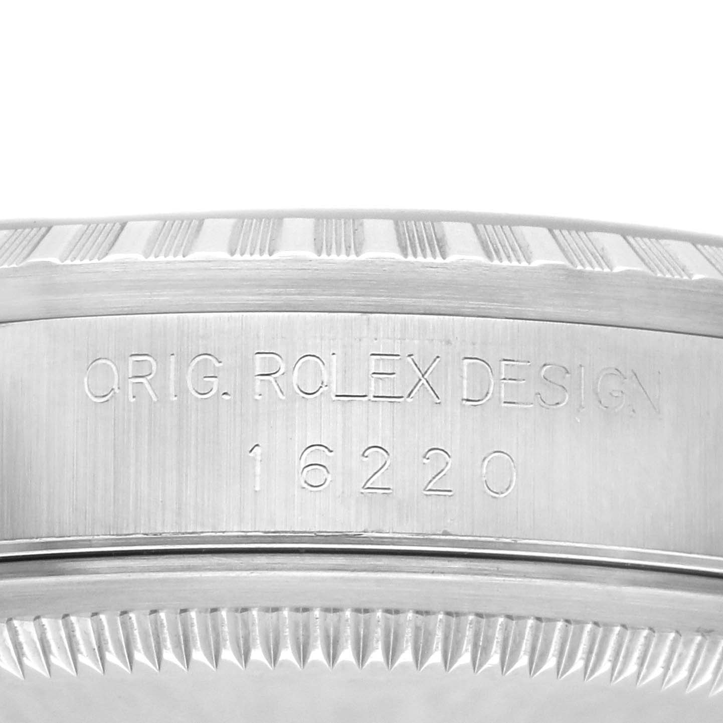 The image shows a detailed close-up of the side engraving on a Rolex Datejust 16220 Men's Stainless Steel Blue Dial watch, featuring model number "16220".