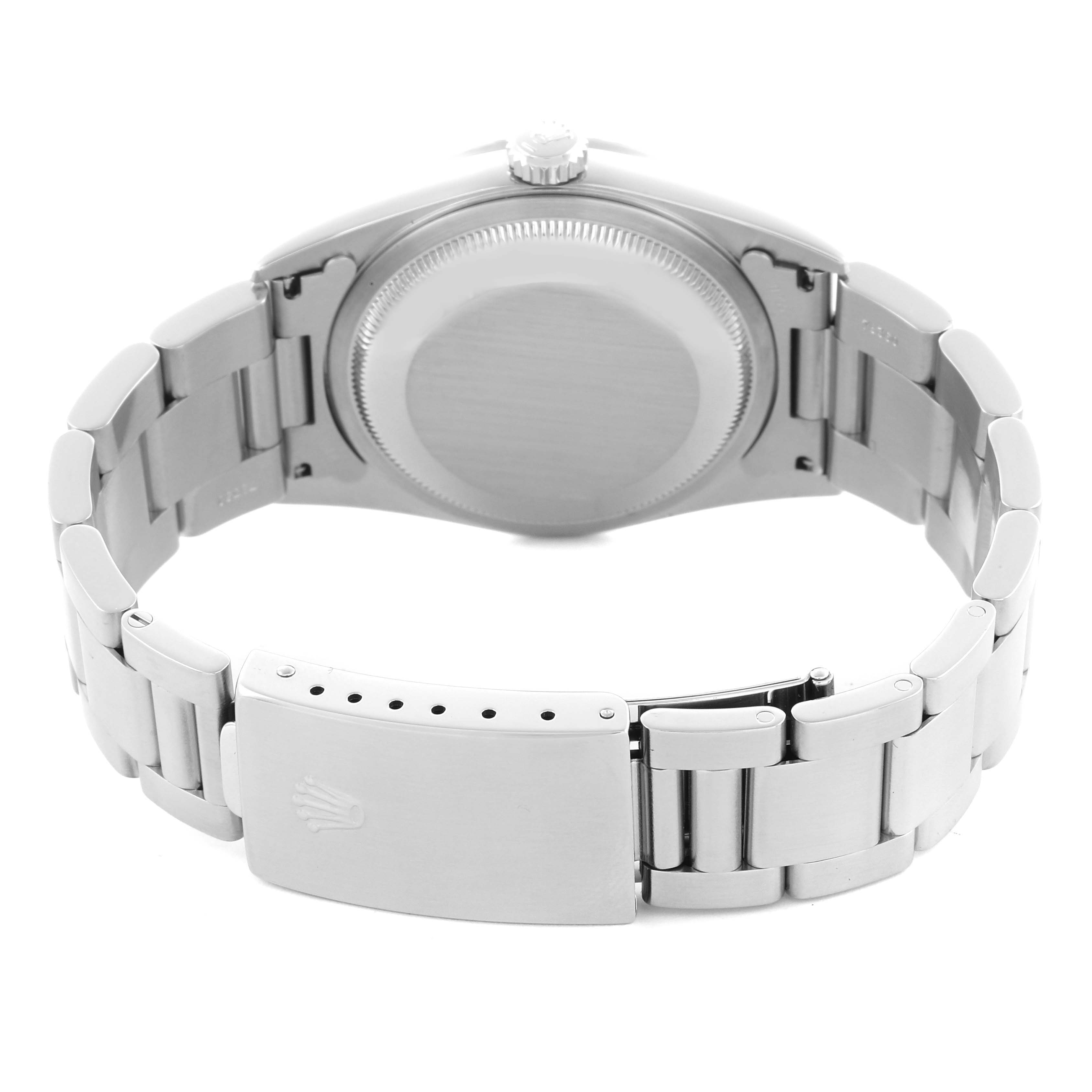 The image shows the back view of a Rolex Datejust 16220 Men's Stainless Steel Blue Dial, focusing on the case back and bracelet clasp.