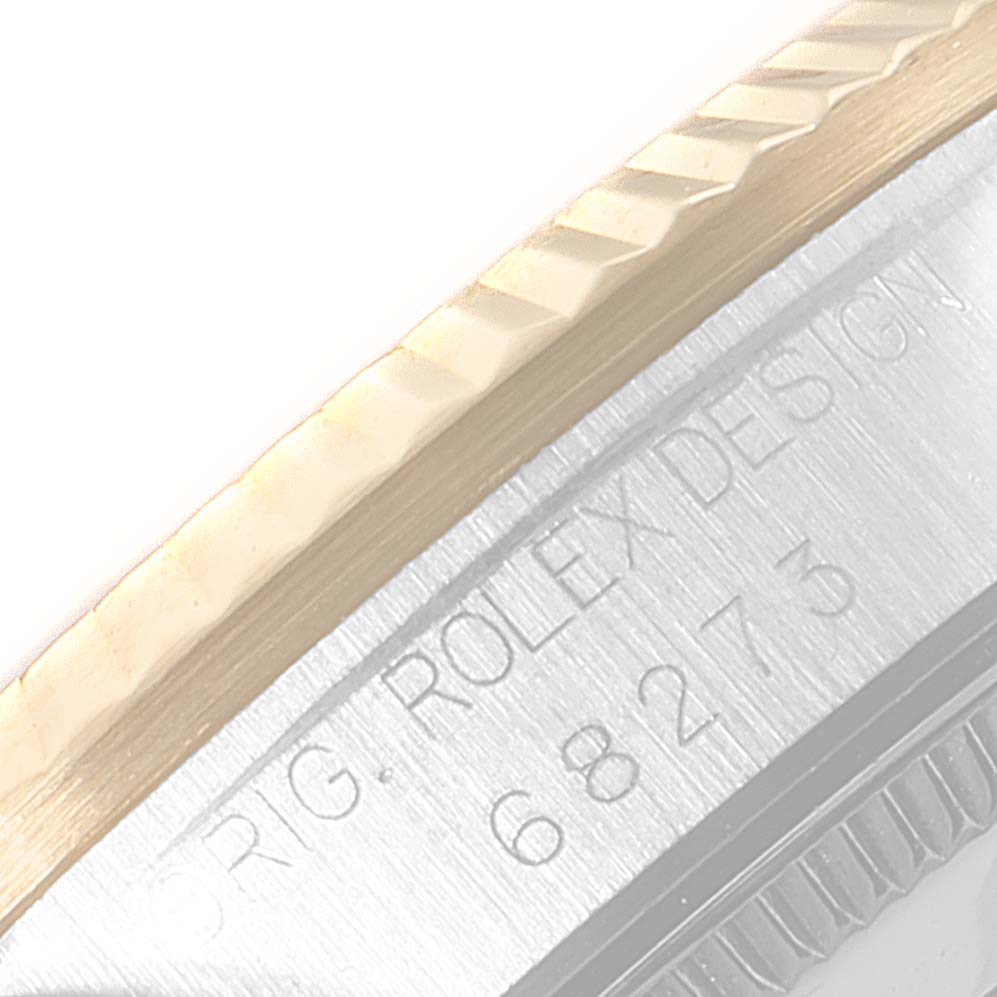 This close-up image shows the engraved side of the Mid-Size Rolex watch with model number 68273.