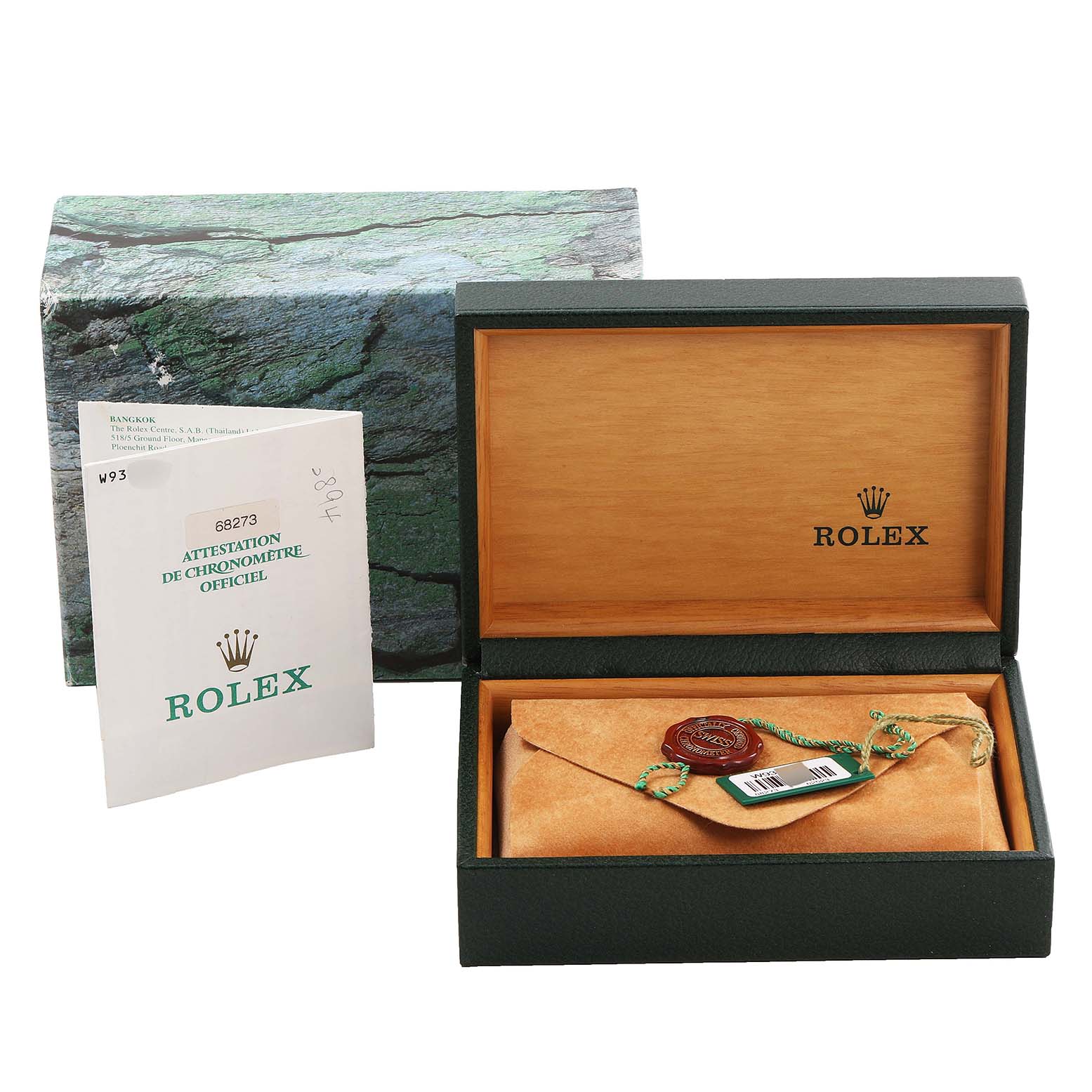 The image shows the open box with a Mid-Size Rolex watch inside, along with the outer box and official chronometer certification.