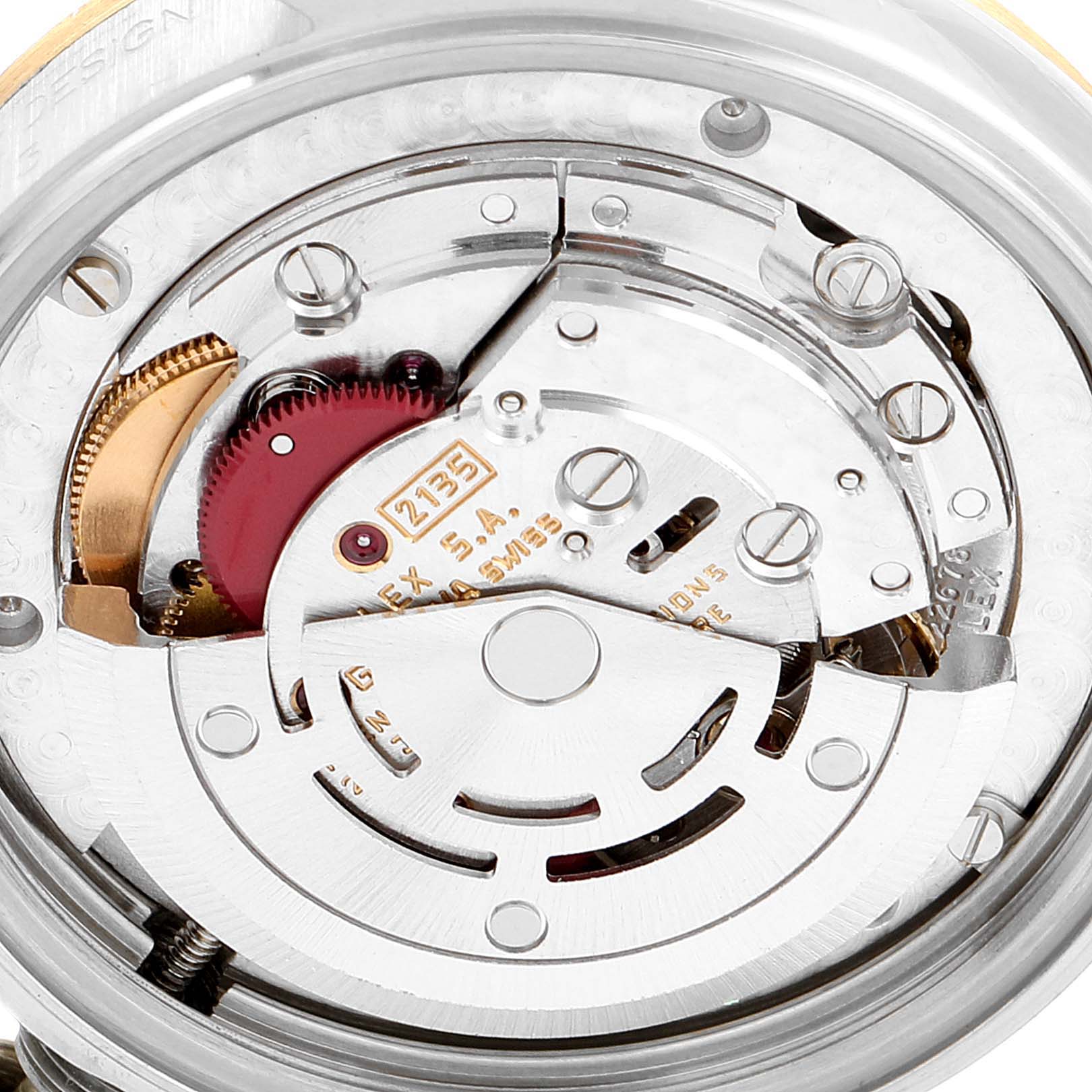 The image shows the intricate internal mechanism of a Rolex Mid-Size 68273 Women
s Steel and Gold (two tone) Champagne Dial 68273 Women
s Steel and Gold (two tone) Champagne Dial model watch, focusing on its movement and gears.