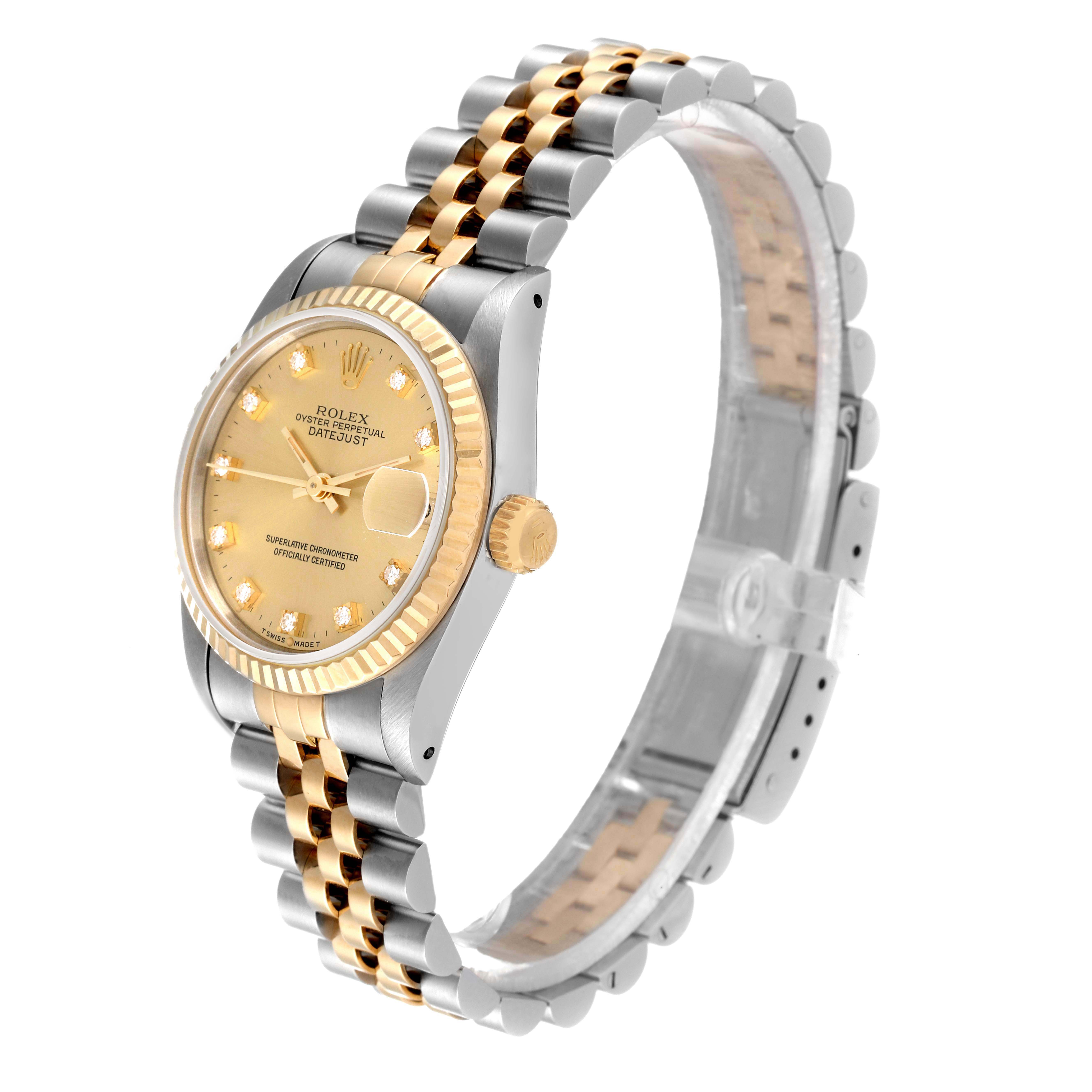 This image shows a Rolex Mid-Size 68273 Women
s Steel and Gold (two tone) Champagne Dial 68273 Women
s Steel and Gold (two tone) Champagne Dial Datejust watch from a 3/4 angle, highlighting its two-tone bracelet and gold dial.