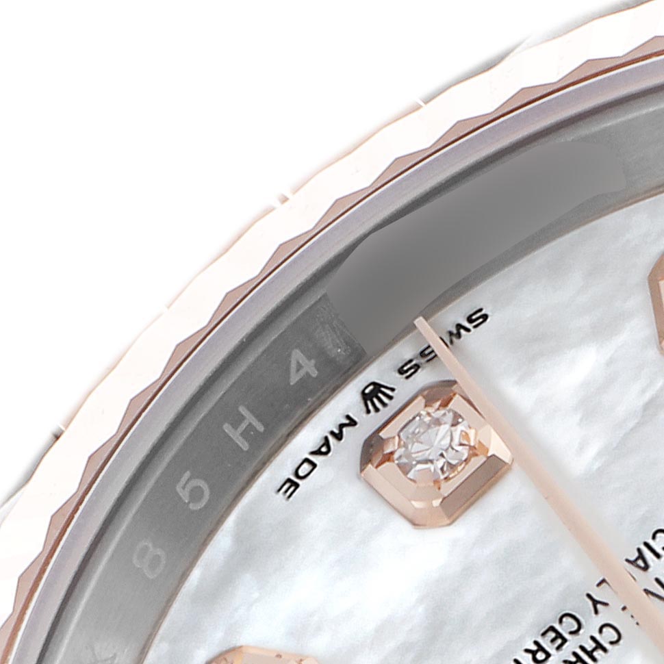 The image shows a close-up of the Rolex Datejust 126231 Men's Steel and Gold (two tone) Mother of Pearl Dial 126231 Men's Steel and Gold (two tone) Mother of Pearl Dial's watch face edge, highlighting the fluted bezel, dial details, and Swiss Made text.