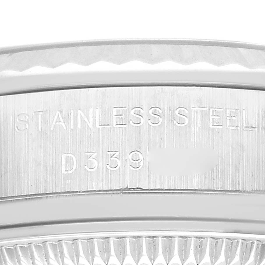 The image shows a close-up of the edge detailing and engraving on the stainless steel case of a Rolex Datejust 179174 Women's Stainless Steel Mother of Pearl Dial 179174 Women's Stainless Steel Mother of Pearl Dial watch.