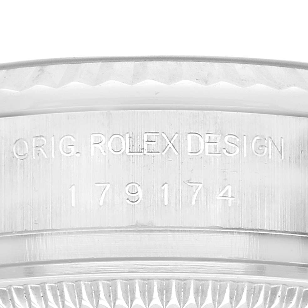 The image shows a close-up of the side of a Rolex Datejust 179174 Women's Stainless Steel Mother of Pearl Dial 179174 Women's Stainless Steel Mother of Pearl Dial, focusing on the engraved model number and design details.