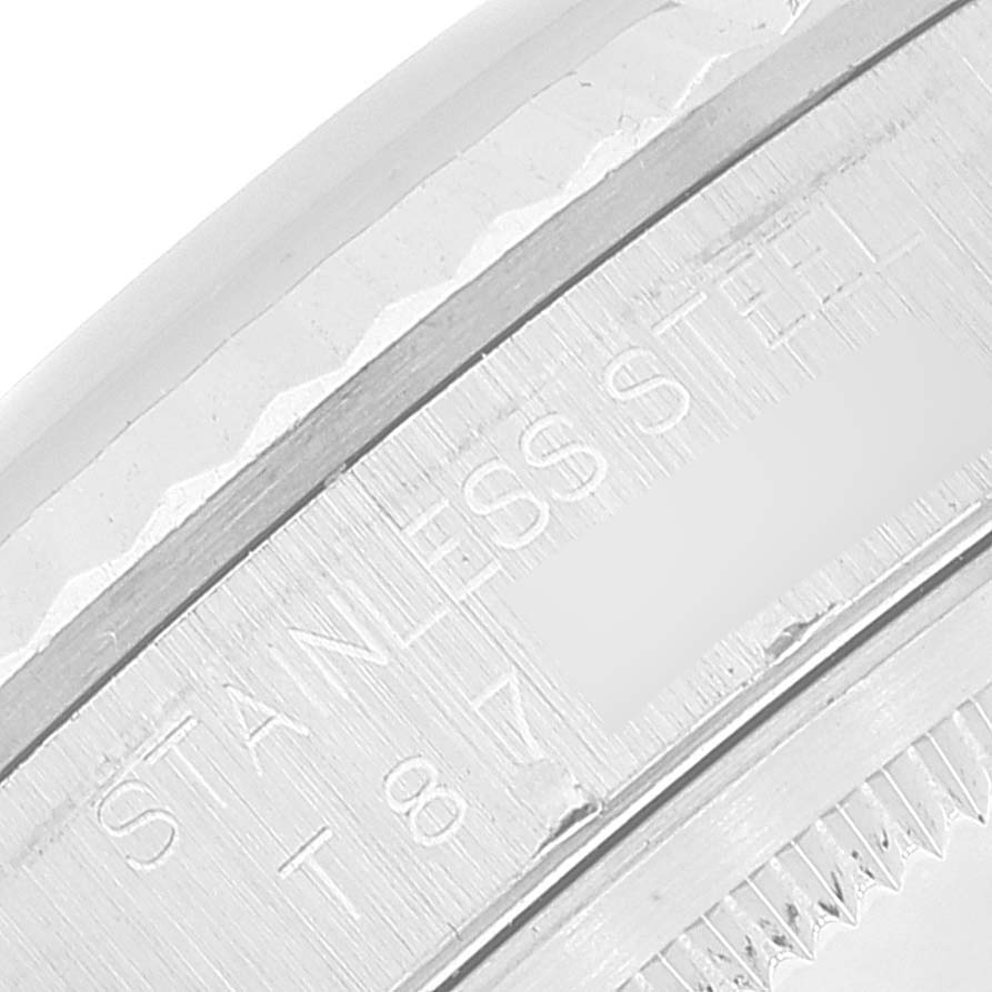 This image shows a close-up of the bezel and the stainless steel engraving on the side of the Rolex Datejust 16234 Men's Stainless Steel White Dial 16234 Men's Stainless Steel White Dial.