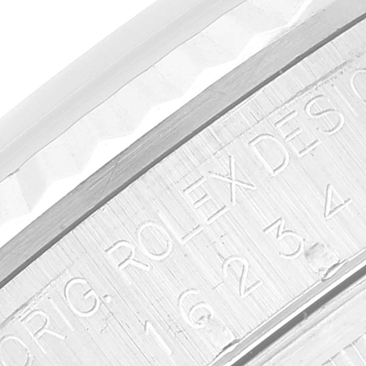 This is a close-up of the bezel and part of the engraving on the Rolex Datejust 16234 Men's Stainless Steel White Dial 16234 Men's Stainless Steel White Dial watch.