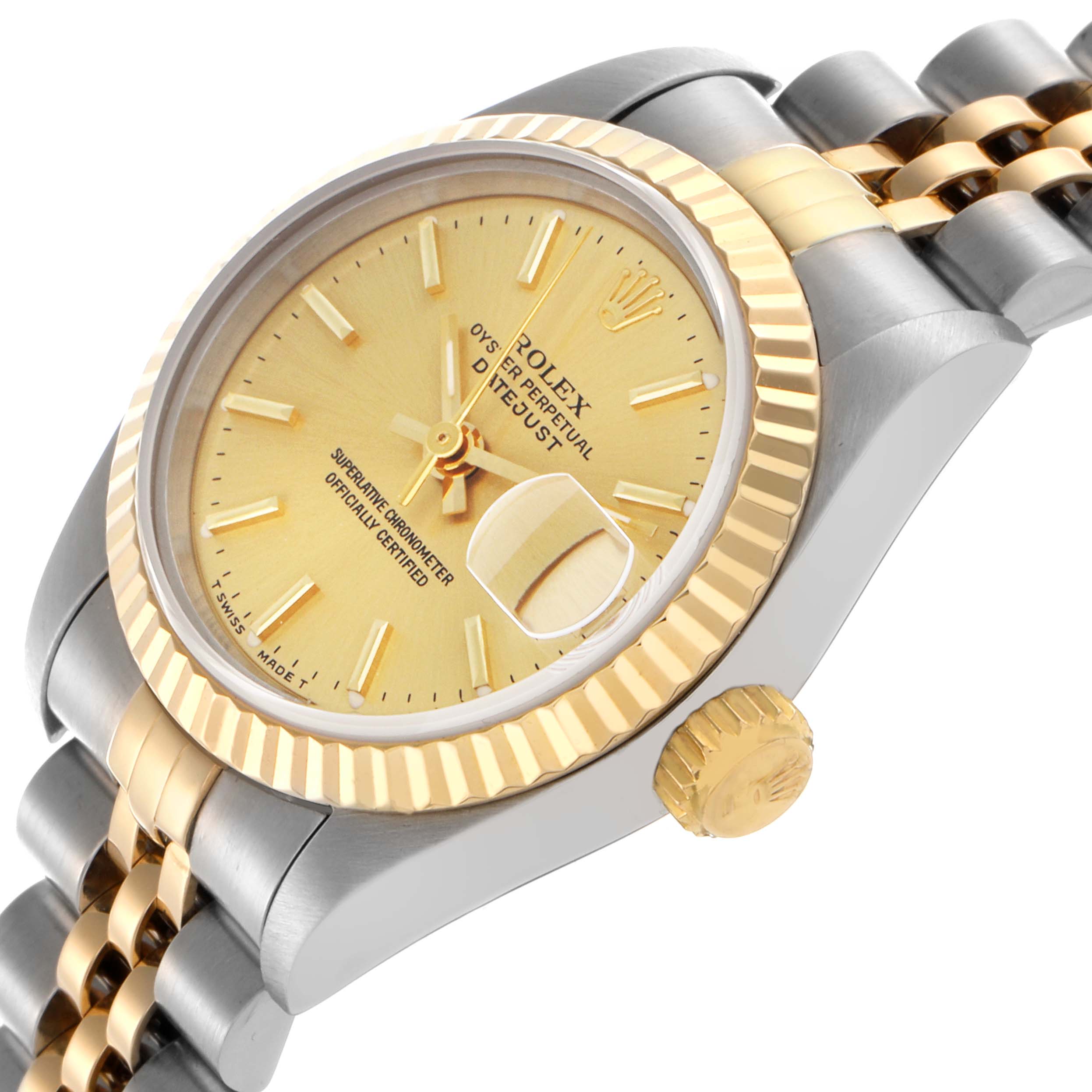 The Rolex Datejust 69173 Women's Steel and Gold (two tone) Champagne Dial 69173 Women's Steel and Gold (two tone) Champagne Dial is shown at an angle highlighting its gold dial, date magnifier, fluted bezel, crown, and bracelet.