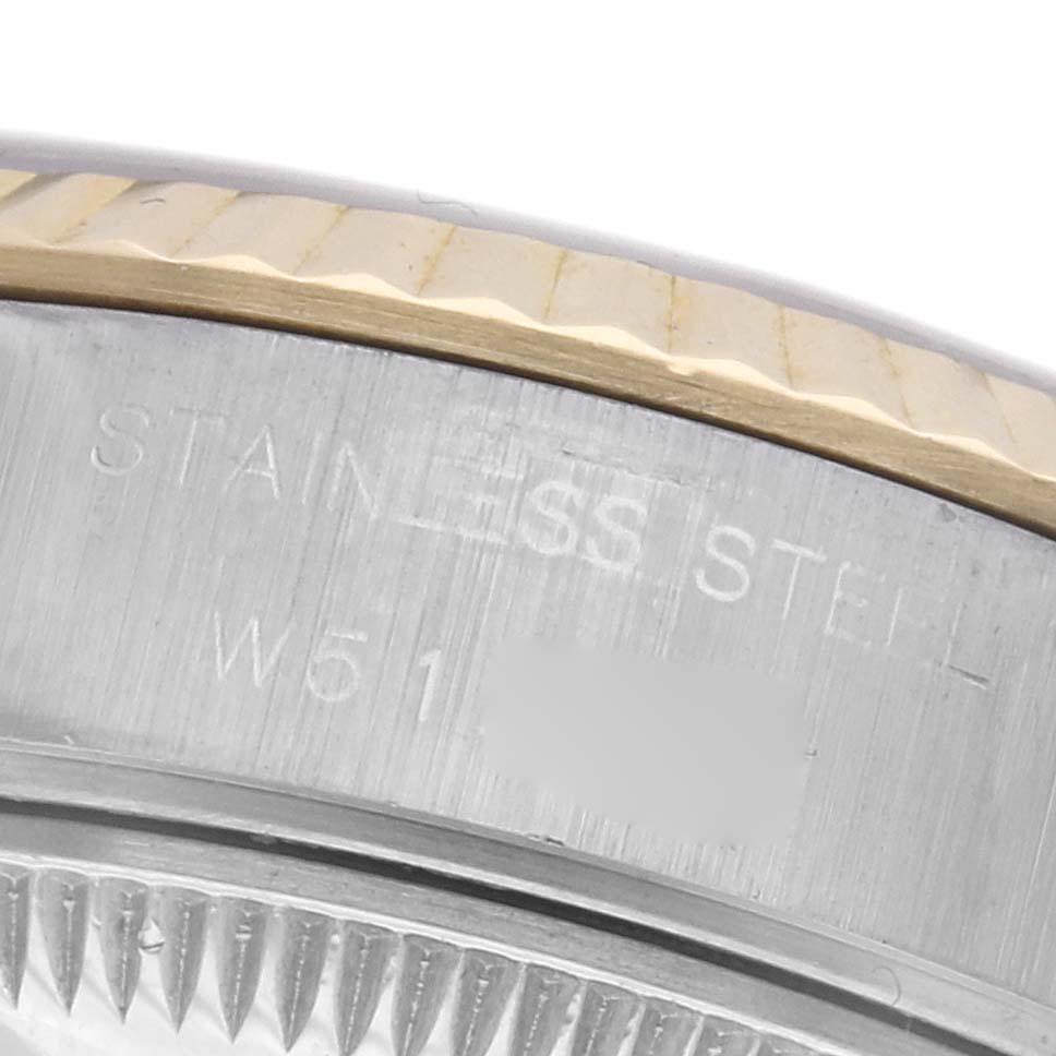 The image shows a close-up of the Rolex Datejust 69173 Women's Steel and Gold (two tone) Champagne Dial 69173 Women's Steel and Gold (two tone) Champagne Dial's case side and bezel, highlighting the stainless steel and gold detailing.