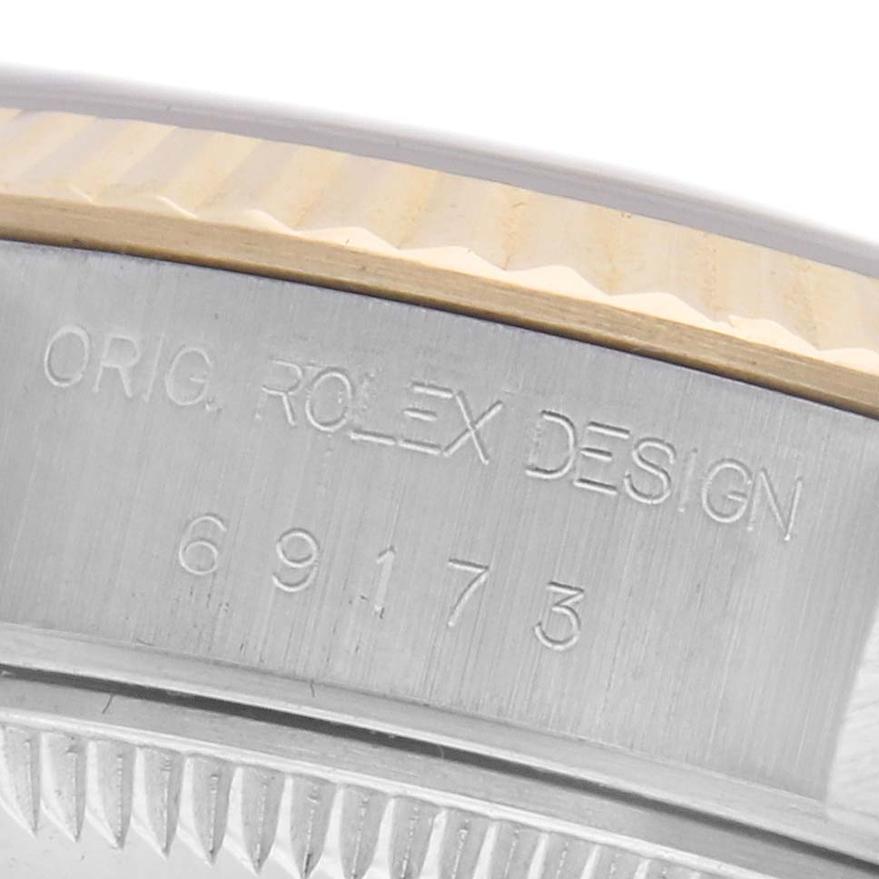The image shows a close-up of the side engraving with the Rolex Datejust 69173 Women's Steel and Gold (two tone) Champagne Dial 69173 Women's Steel and Gold (two tone) Champagne Dial model number and design details.