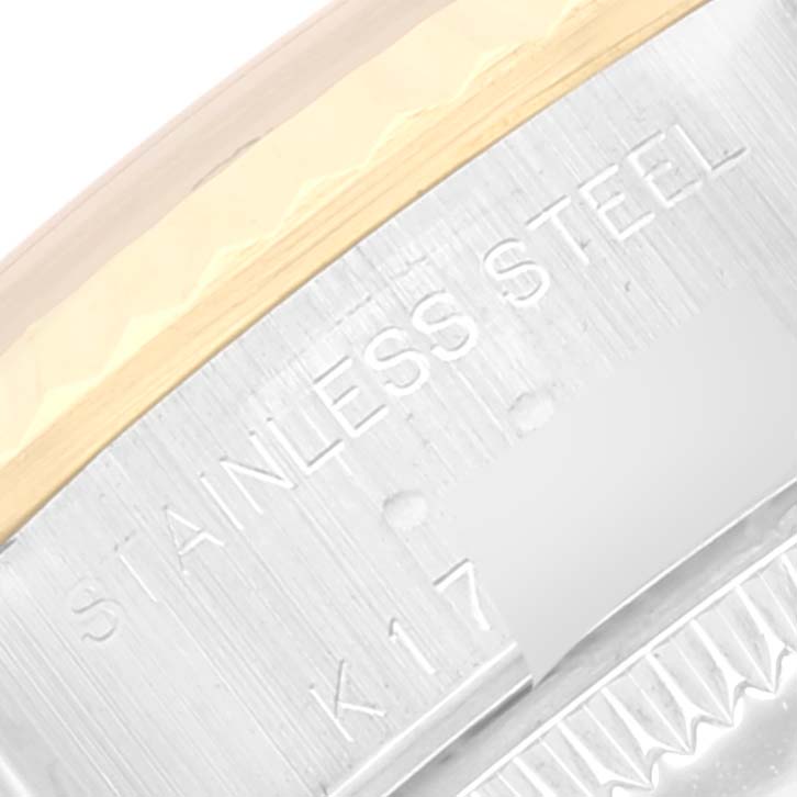 Close-up of the side of the Rolex Datejust 79173 Women's Steel and Gold (two tone) Blue Dial 79173 Women's Steel and Gold (two tone) Blue Dial watch bezel and case, showing the "STAINLESS STEEL" engraving.