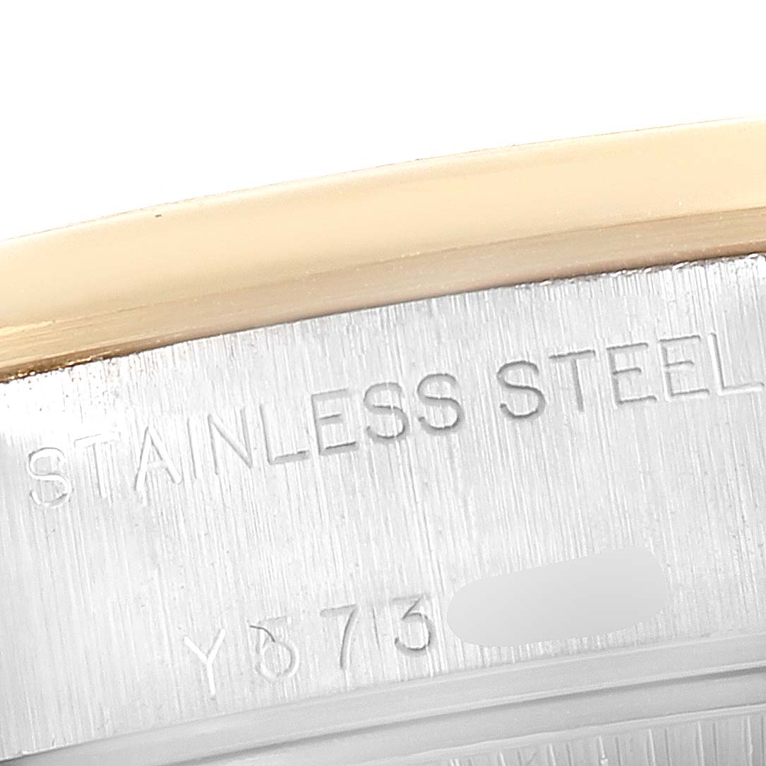 This image shows a close-up of the side engraving on a Rolex Datejust 79163 Women's Steel and Gold (two tone) Silver Dial 79163 Women's Steel and Gold (two tone) Silver Dial watch, highlighting the "STAINLESS STEEL" text.