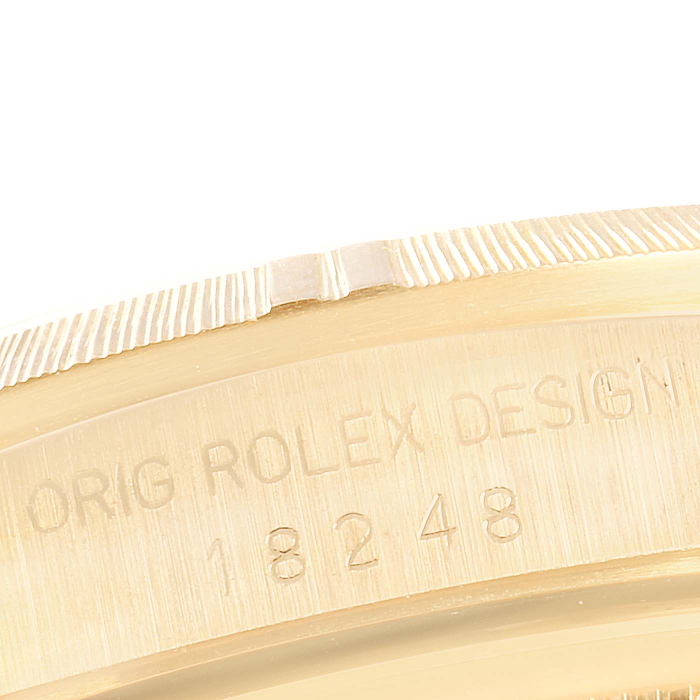 The image shows a close-up view of the bezel and case side inscription of a Rolex President 18248 Men
s Yellow Gold Champagne Dial 18248 Men
s Yellow Gold Champagne Dial model watch.