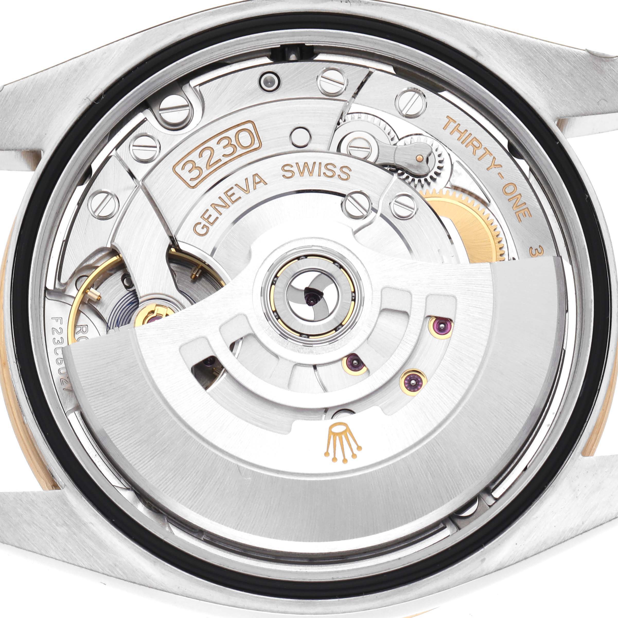 The image shows the movement of a Rolex Explorer 124273 Men's Steel and Gold (two tone) Black Dial 124273 Men's Steel and Gold (two tone) Black Dial watch, viewed from the back, highlighting its intricate components.