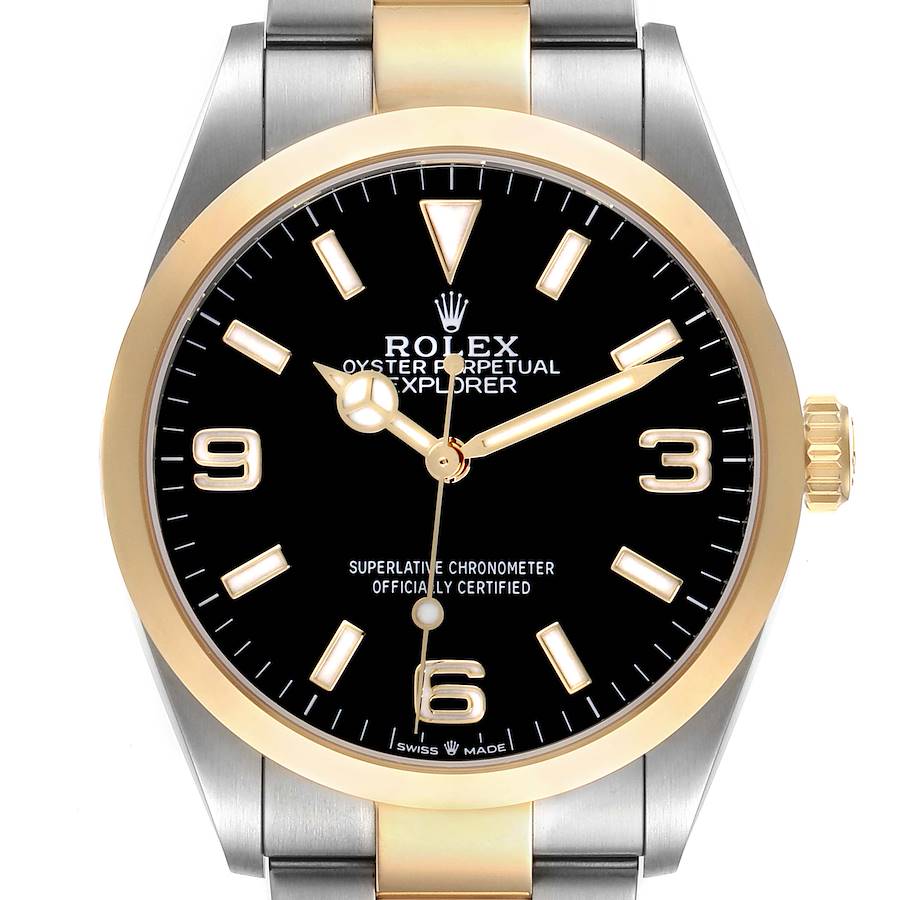 The Rolex Explorer watch is shown from the front, displaying its face, bezel, and part of the bracelet.