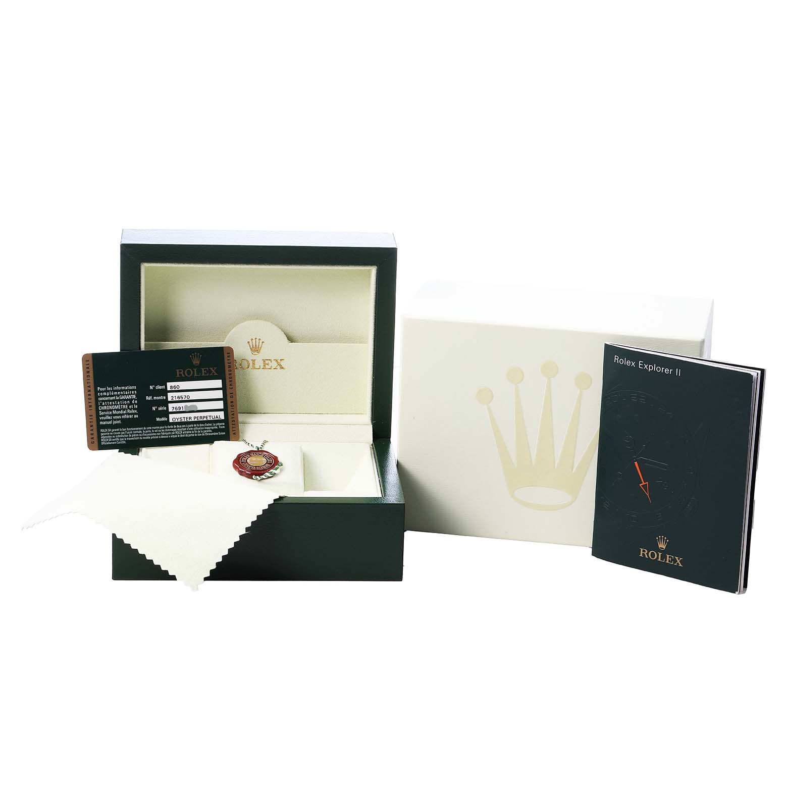 The image shows the packaging and accessories for a Rolex Explorer 216570 Men's Stainless Steel White Dial watch, including the box, manual, card, and cloth.