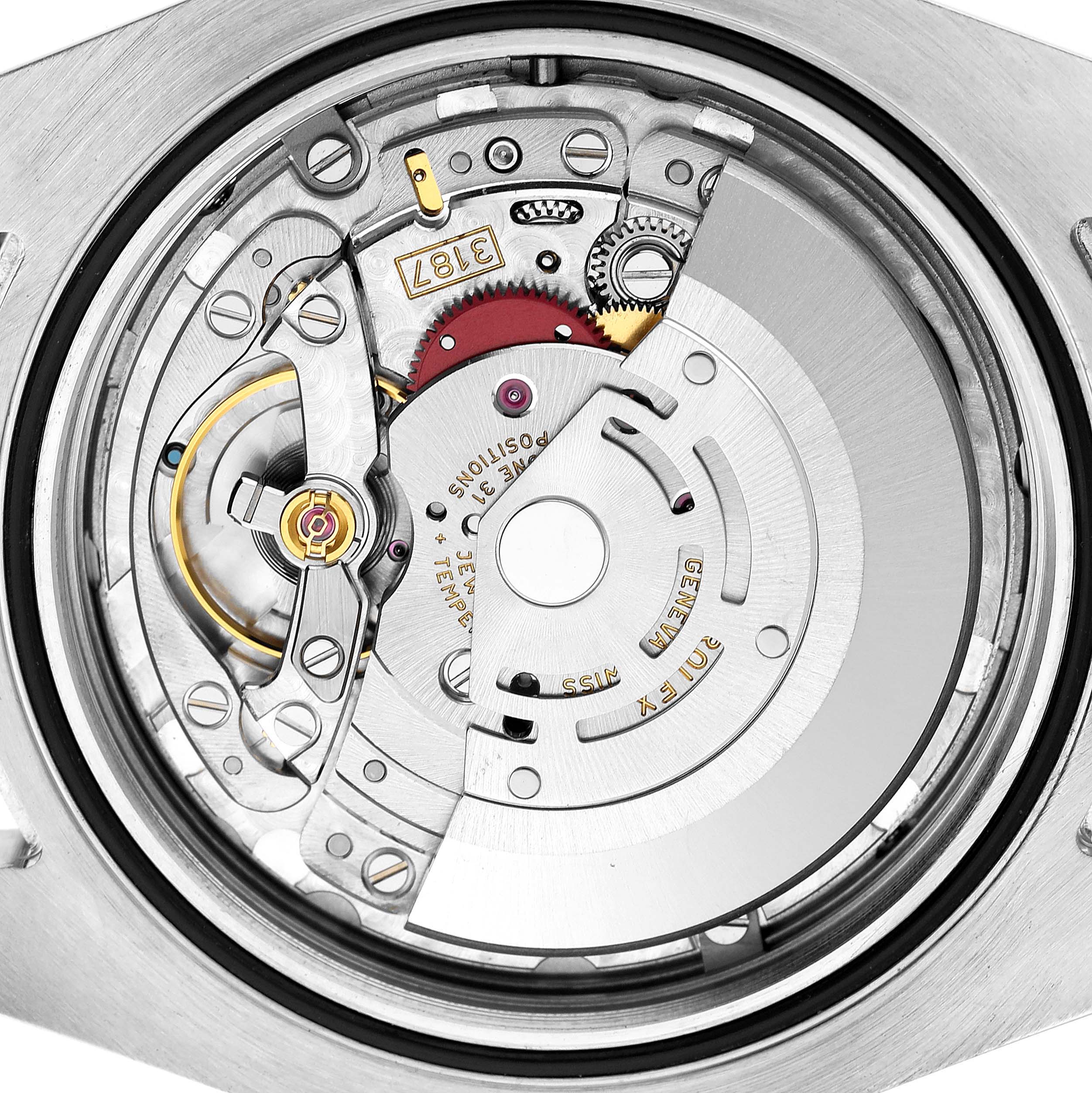 The image shows the open case back of a Rolex Explorer 216570 Men's Stainless Steel White Dial, revealing its intricate movement parts and mechanisms.