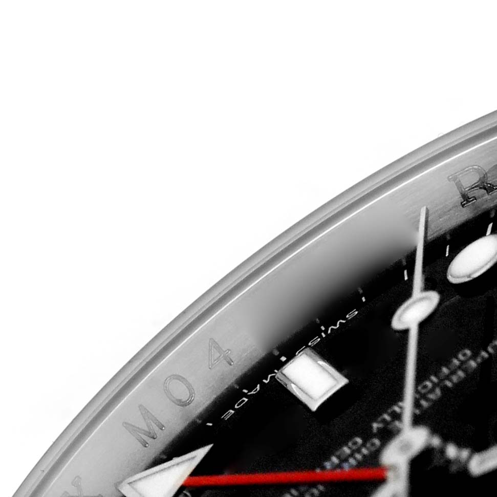 This close-up of the Rolex Explorer 16570 Men's Stainless Steel Black Dial watch shows part of the dial, hands, and indices from an angled view.