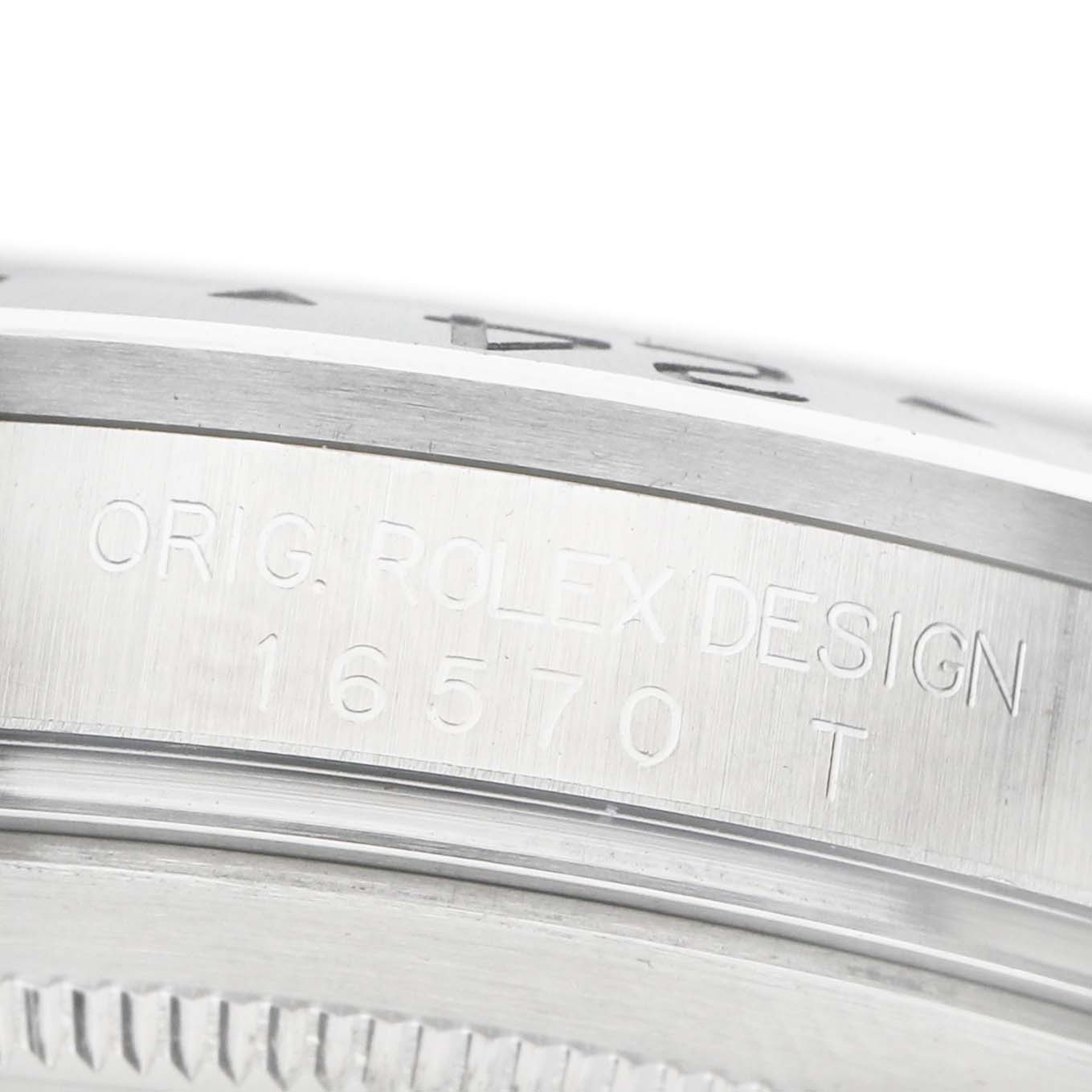 The image shows a close-up of the side of a Rolex Explorer 16570 Men's Stainless Steel Black Dial, highlighting its bezel and engraved model number.