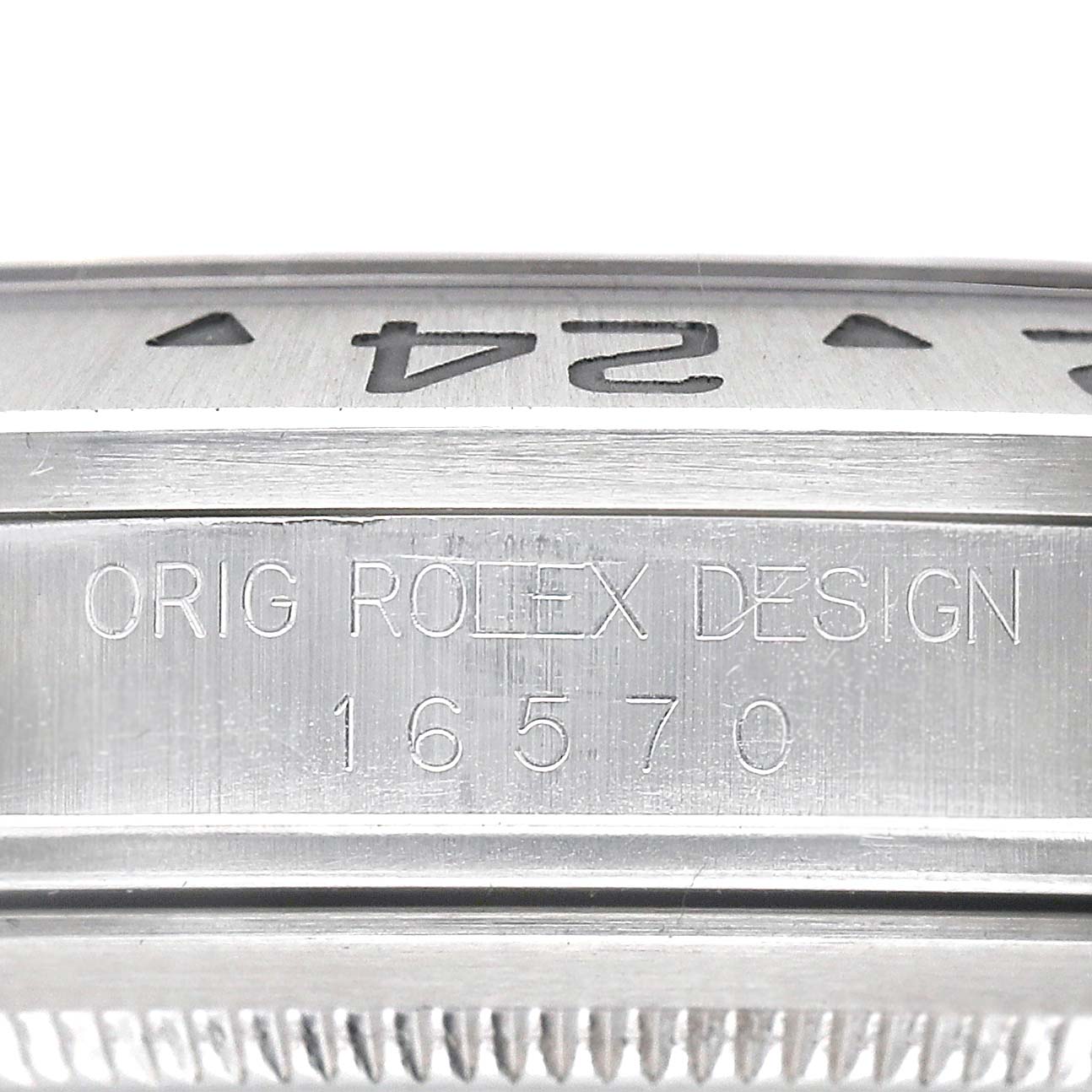 This image shows a close-up of the watch's side, highlighting the engraving "ORIG ROLEX DESIGN 16570" on the Rolex Explorer 16570 Men's Stainless Steel White Dial.