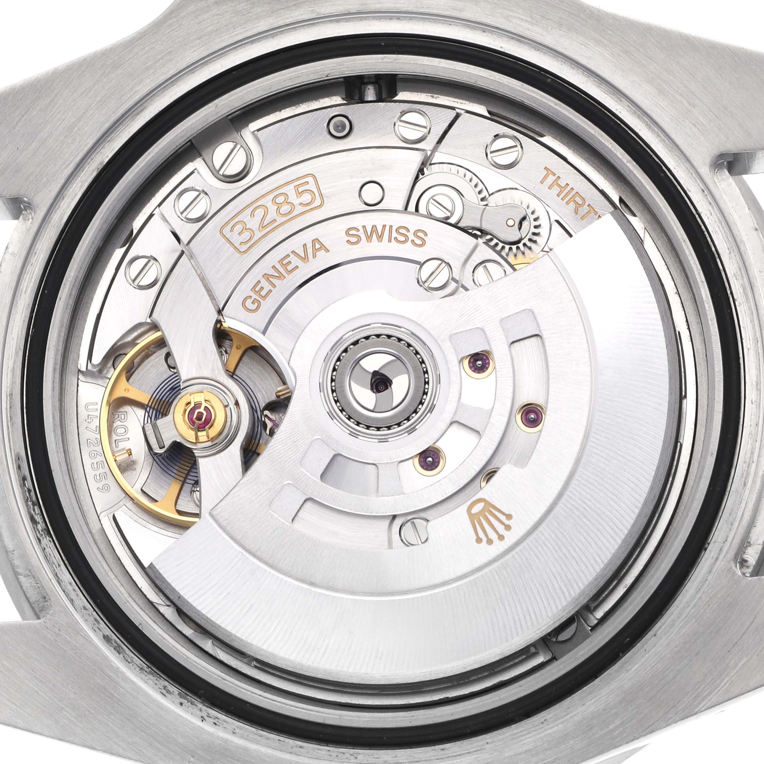 The image shows the open case back of a Rolex GMT-Master 126710 Men's Stainless Steel Black Dial 126710 Men's Stainless Steel Black Dial watch, highlighting its intricate movement and rotor.