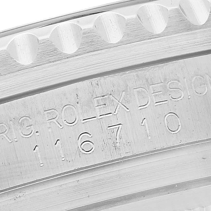 The image shows the engraved part of the bezel and case side of a Rolex GMT-Master 116710 Men
s Stainless Steel Black Dial 116710 Men
s Stainless Steel Black Dial, displaying its model number.