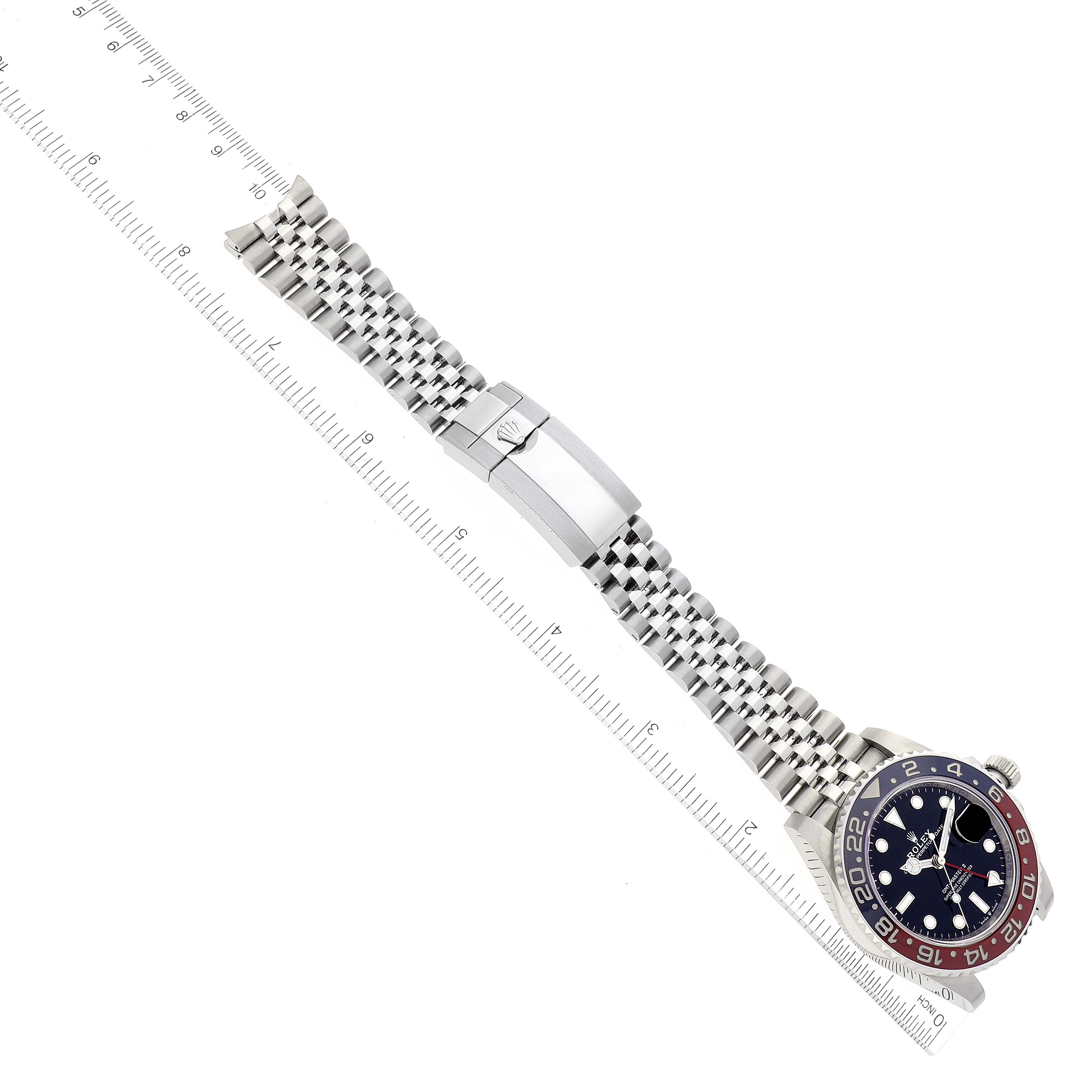 The image shows a top view of a Rolex GMT-Master 126710 Men
s Stainless Steel Black Dial 126710 Men
s Stainless Steel Black Dial watch highlighting the dial, bezel, and metal bracelet.
