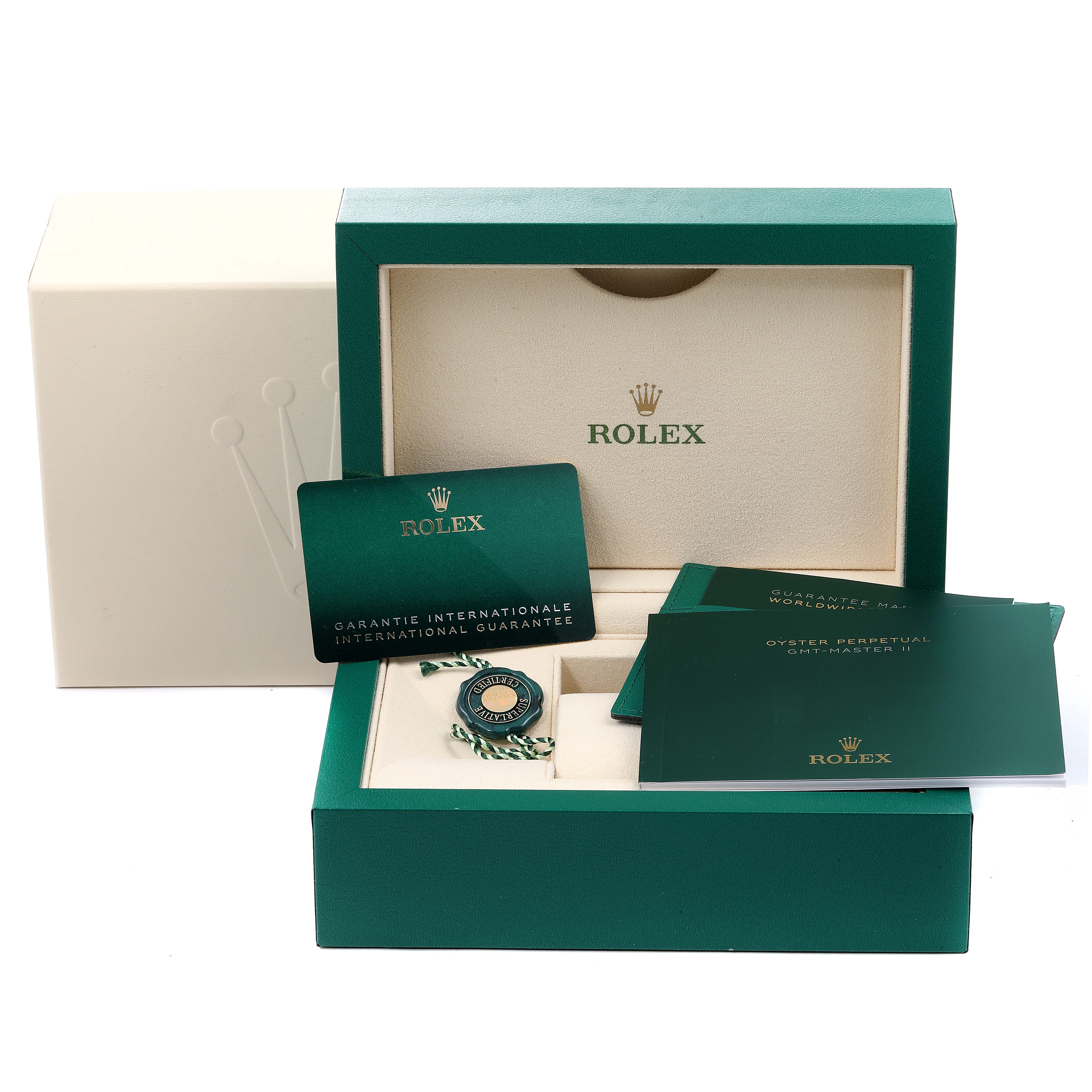The image shows the packaging, warranty card, and booklets for a Rolex GMT-Master 126711 Men
s Stainless Steel Black Dial 126711 Men
s Stainless Steel Black Dial watch, but not the watch itself.