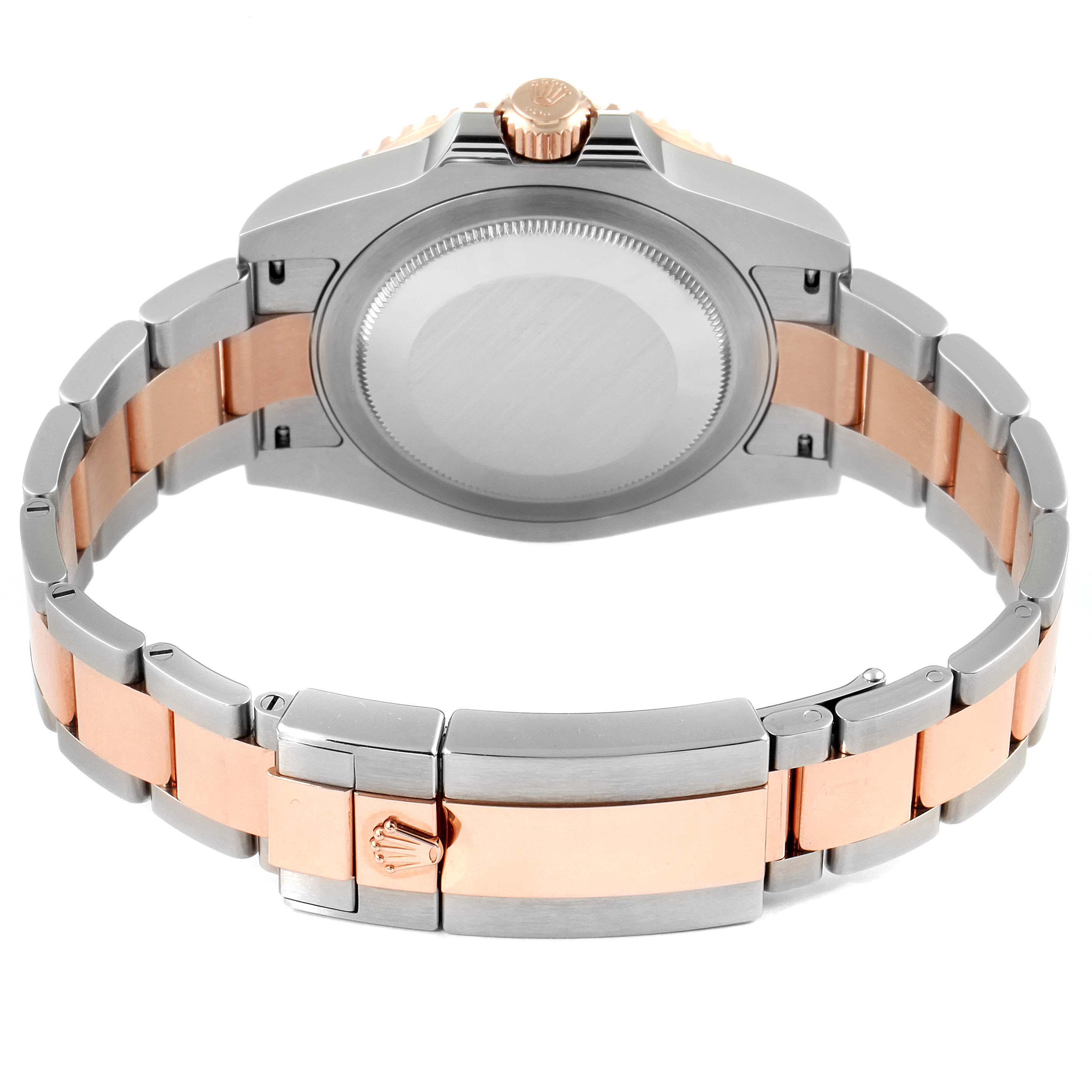 This image shows the back view of a Rolex GMT-Master 126711 Men
s Stainless Steel Black Dial 126711 Men
s Stainless Steel Black Dial, featuring its case, crown, and two-tone bracelet.