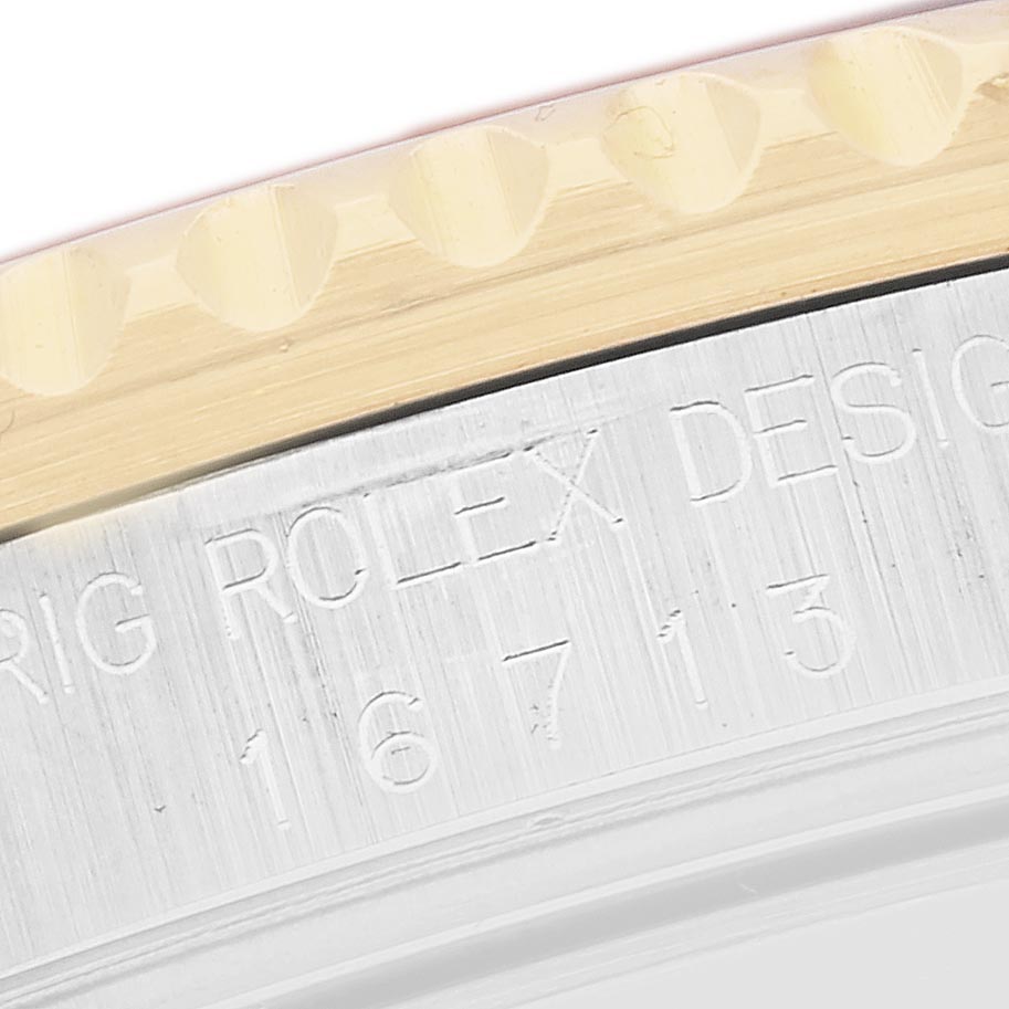 The image shows a close-up of the engraved side of the bezel and case of a Rolex GMT-Master 16713 Men's Steel and Gold (two tone) Brown Dial 16713 Men's Steel and Gold (two tone) Brown Dial, displaying the model number.