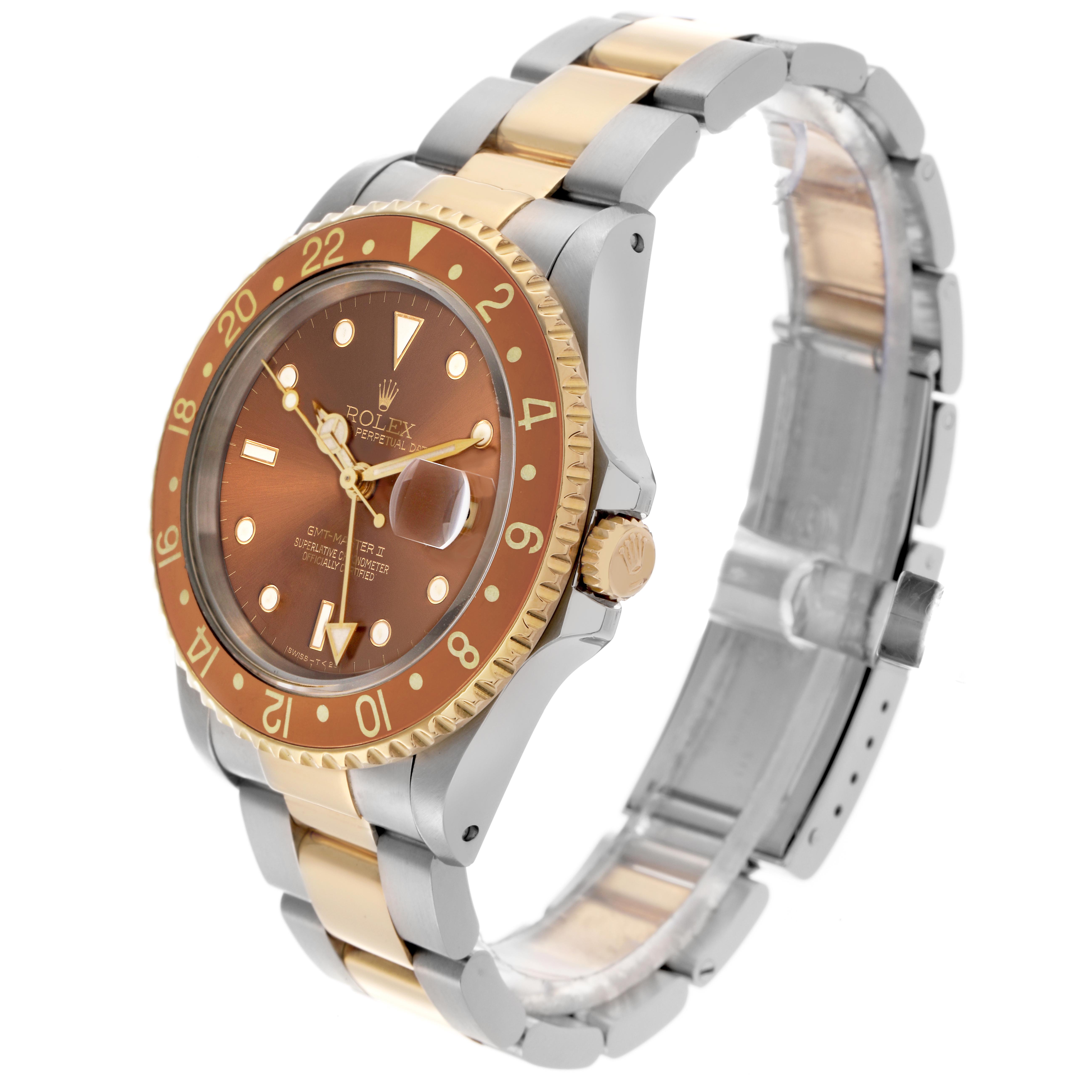 The Rolex GMT-Master 16713 Men's Steel and Gold (two tone) Brown Dial 16713 Men's Steel and Gold (two tone) Brown Dial watch is shown at a three-quarter angle highlighting the bezel, dial, and bracelet.