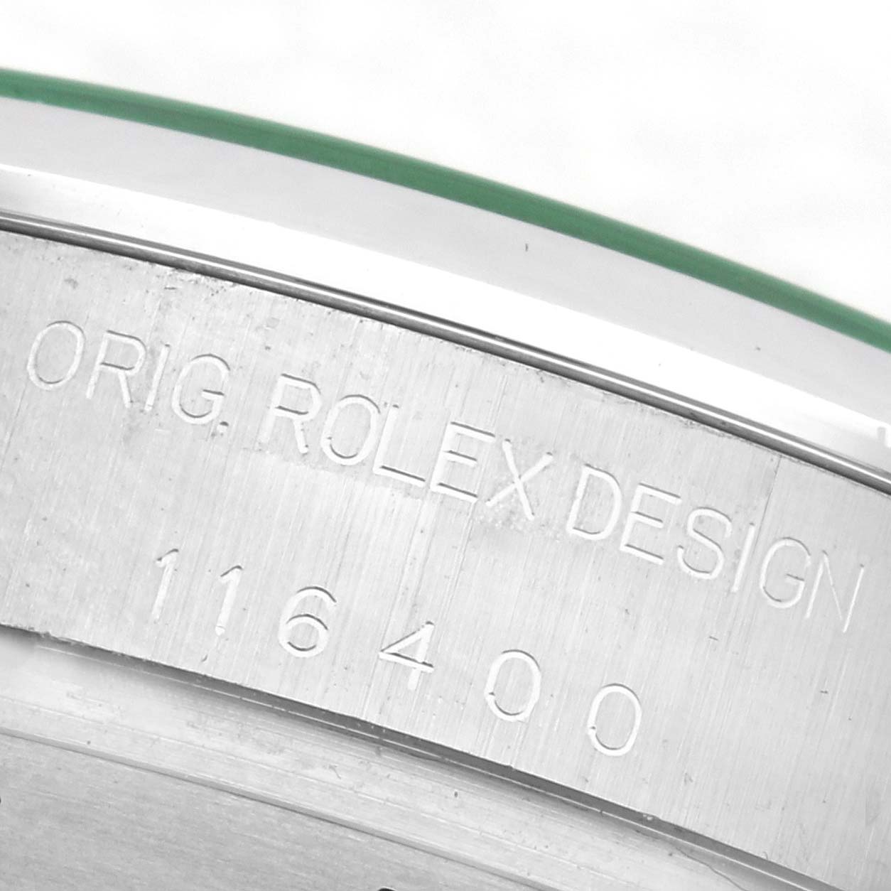 The image shows the side of a Rolex Milgauss 116400GV Men's Stainless Steel Black Dial 116400GV Men's Stainless Steel Black Dial watch case, highlighting the engraved model number "116400" and "ORIG. ROLEX DESIGN".