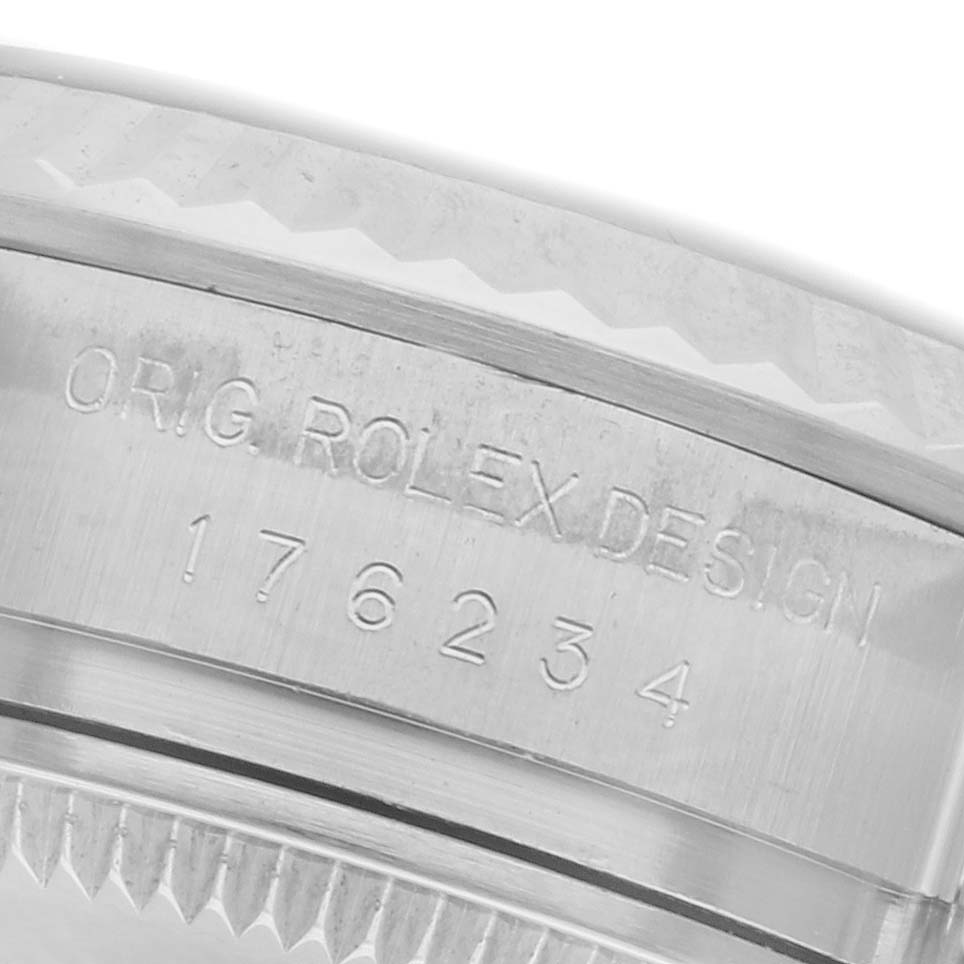 The image shows a close-up of the side of a Rolex Oyster Perpetual 176234 Women's Stainless Steel Silver Dial 176234 Women's Stainless Steel Silver Dial watch, highlighting the engraved design and serial number.