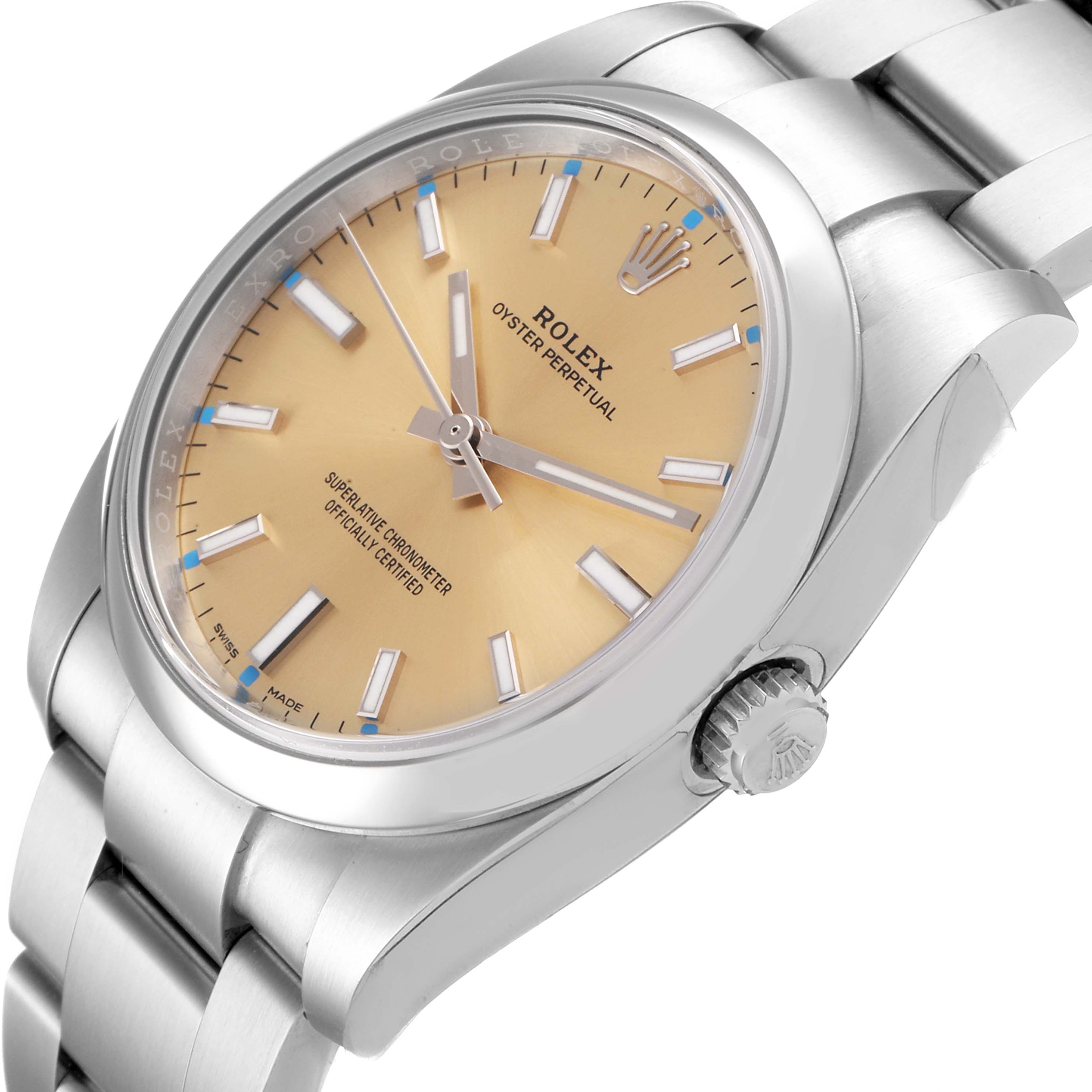The Rolex Oyster Perpetual 114200 Men's Stainless Steel Champagne Dial 114200 Men's Stainless Steel Champagne Dial watch is shown at an angled close-up, highlighting its dial, bezel, and crown.