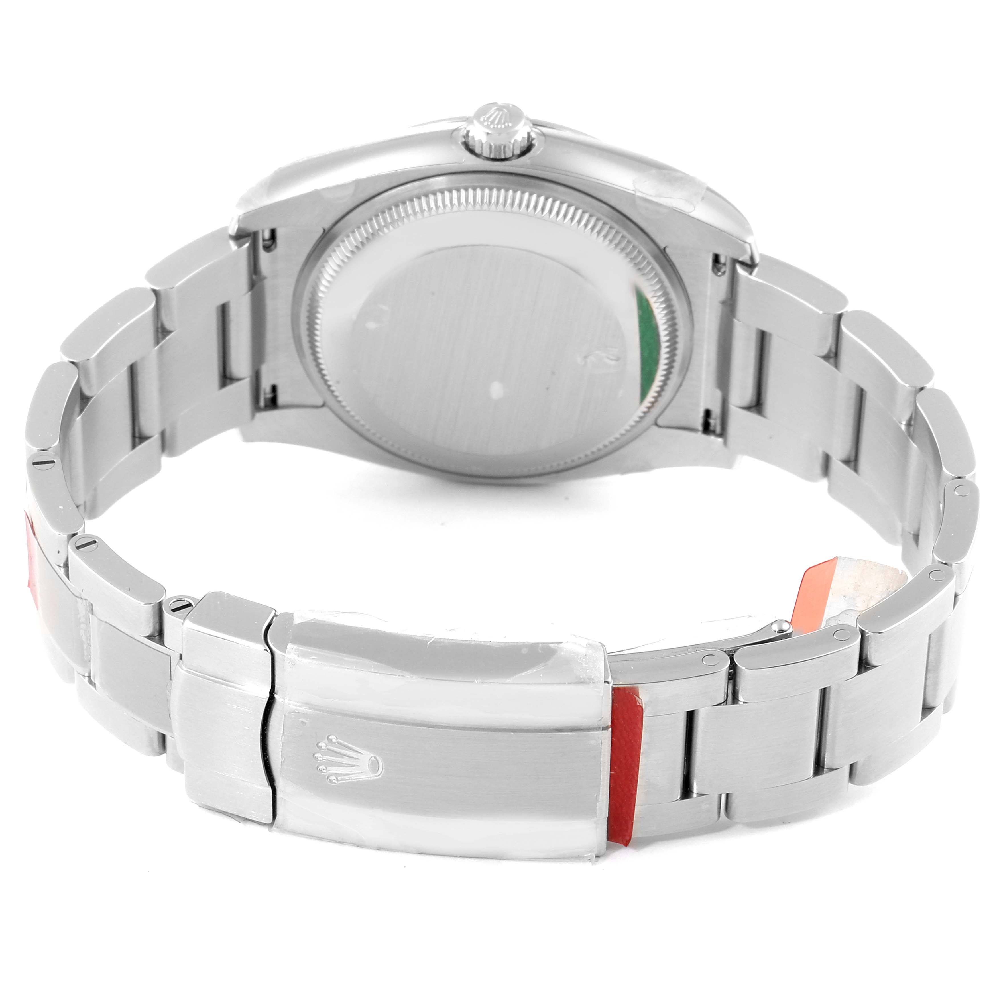 The image shows the back of an Oyster Perpetual Rolex watch, highlighting the bracelet and clasp.