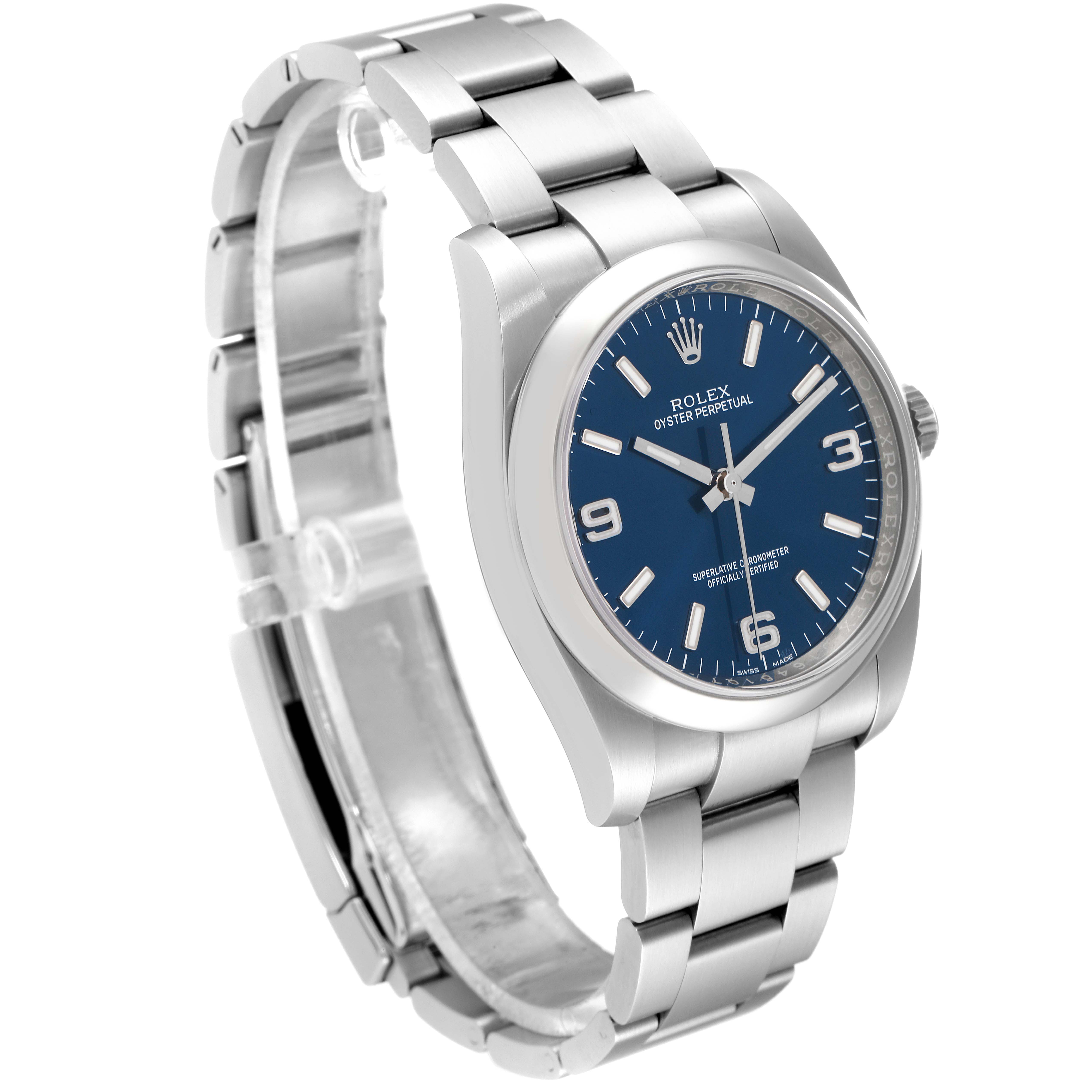 The image shows a Rolex Oyster Perpetual 116000 Men's Stainless Steel Blue Dial 116000 Men's Stainless Steel Blue Dial watch from a slightly angled side view, highlighting the bracelet, case, and blue dial.