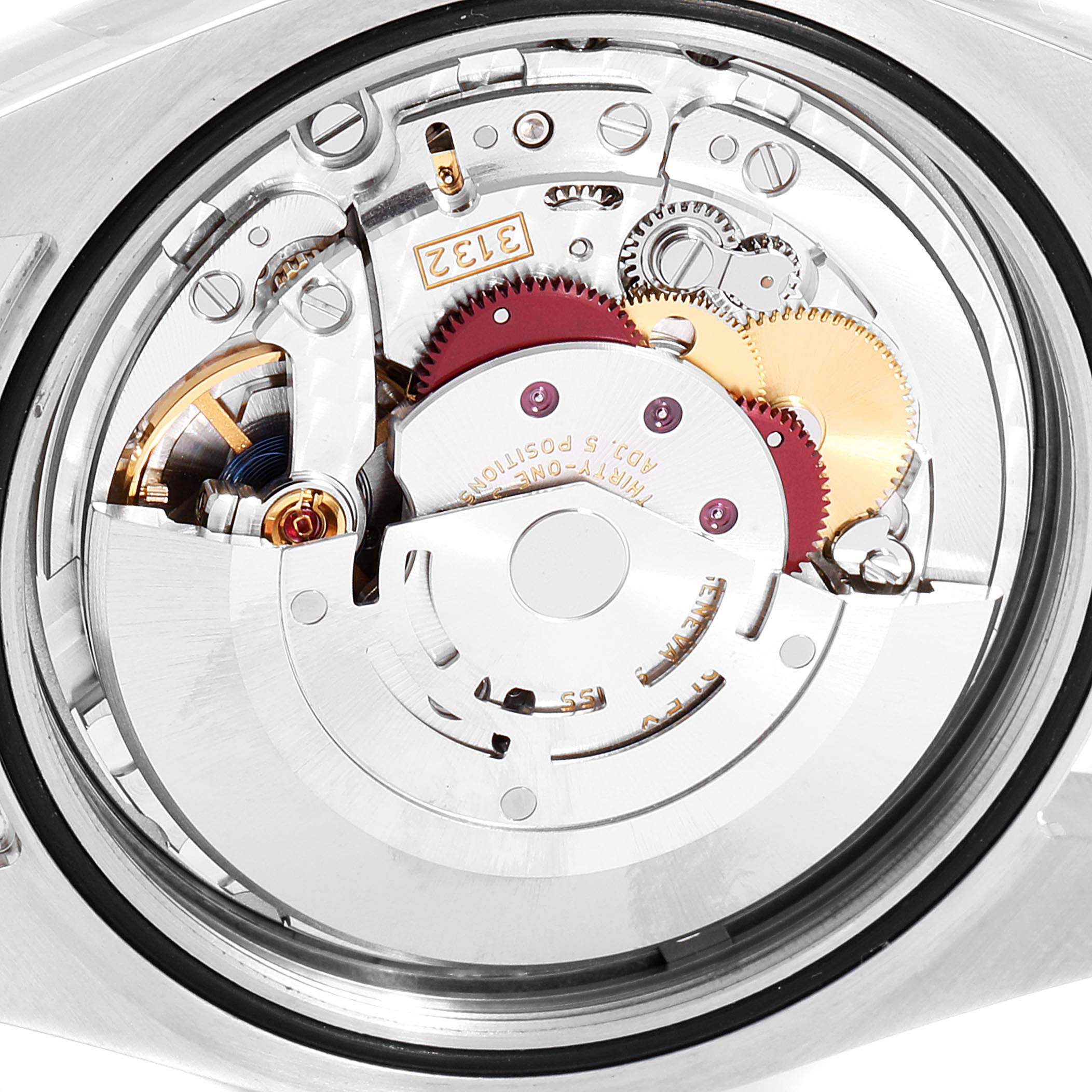 This image shows the internal mechanics, specifically the movement, of a Rolex Oyster Perpetual 114300 Men's Stainless Steel Blue Dial 114300 Men's Stainless Steel Blue Dial watch viewed from the back.