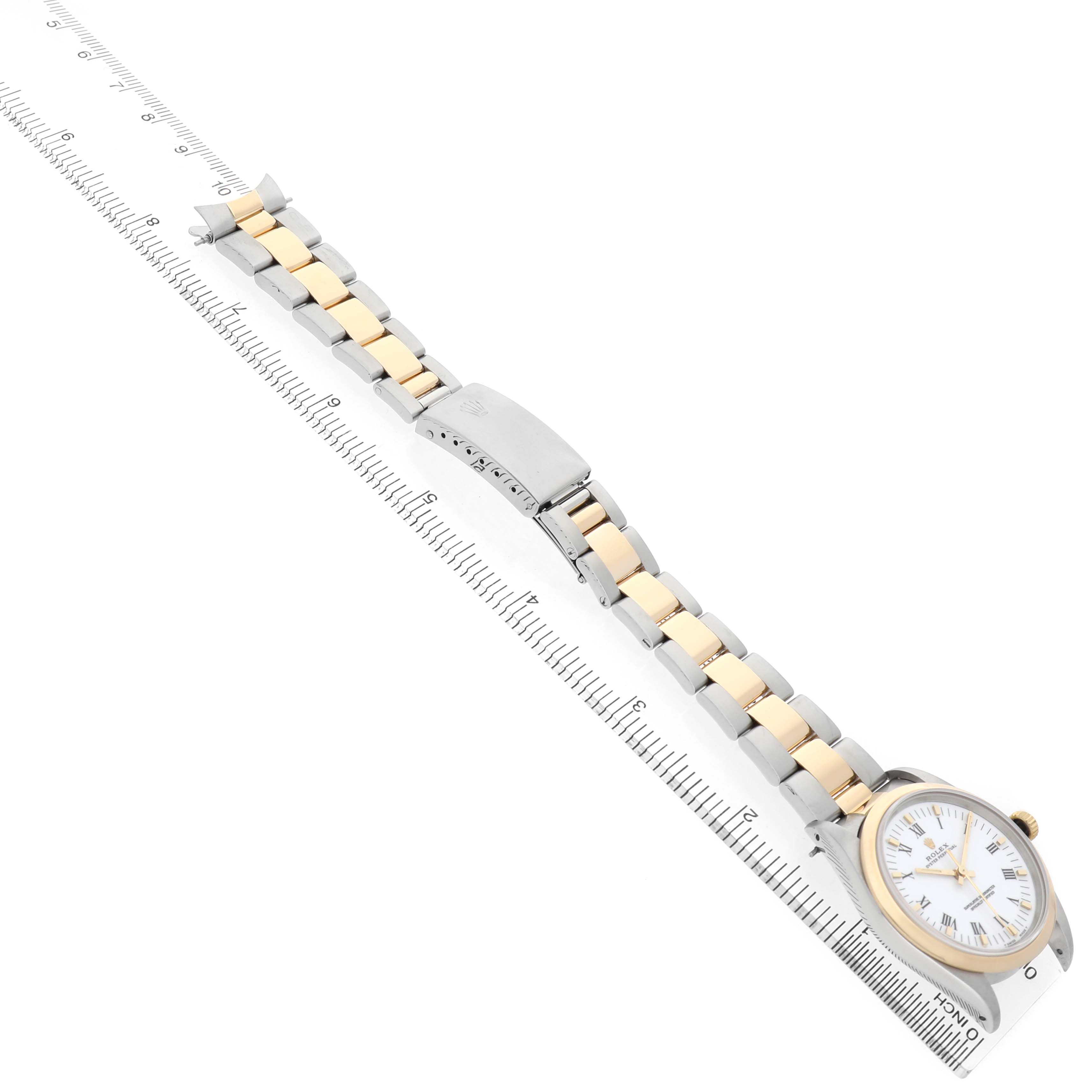 The Rolex Oyster Perpetual 14203 Men's Steel and Gold (two tone) White Dial watch is shown at an angle highlighting the bracelet, clasp, and face.