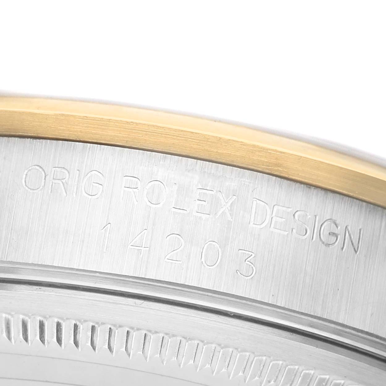 The image shows a close-up of the side of a Rolex Oyster Perpetual 14203 Men's Steel and Gold (two tone) White Dial, displaying engraved text with a model number.